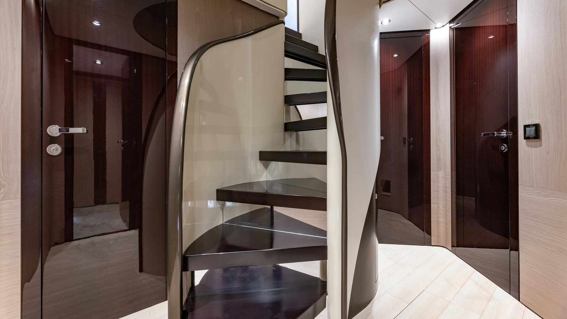a black staircase in a room aboard PIER PRESSURE Yacht for Charter