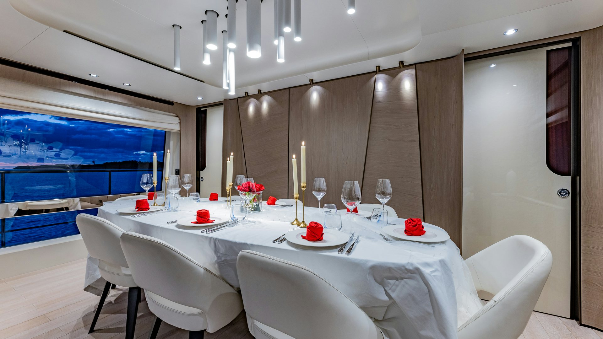 a table with white chairs and white tablecloths aboard PIER PRESSURE Yacht for Charter