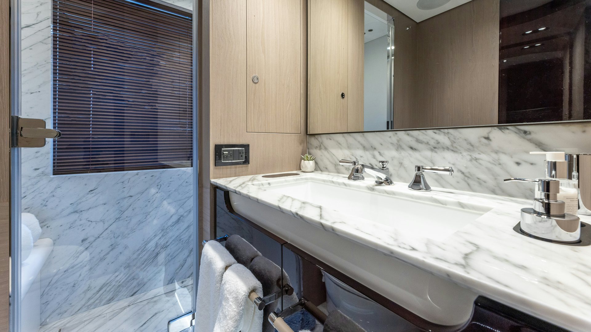 a bathroom with a sink and a bathtub aboard PIER PRESSURE Yacht for Charter