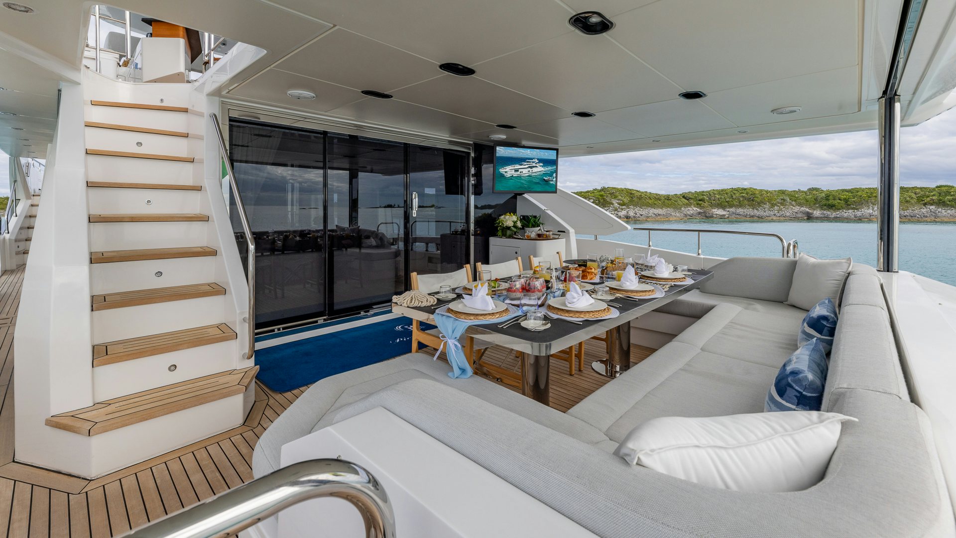 a living room with a large window aboard PIER PRESSURE Yacht for Charter