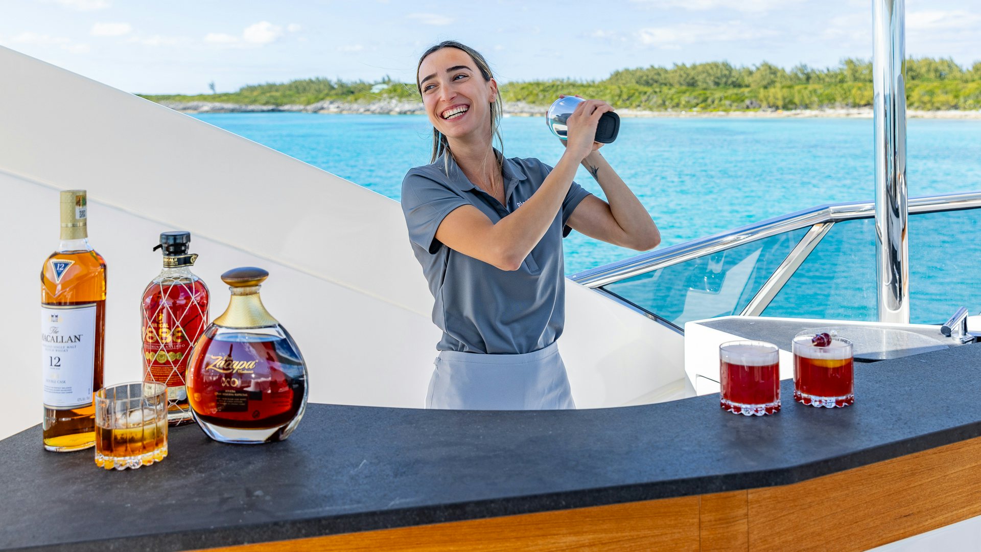 Laura Bergmann holding a camera aboard PIER PRESSURE Yacht for Charter