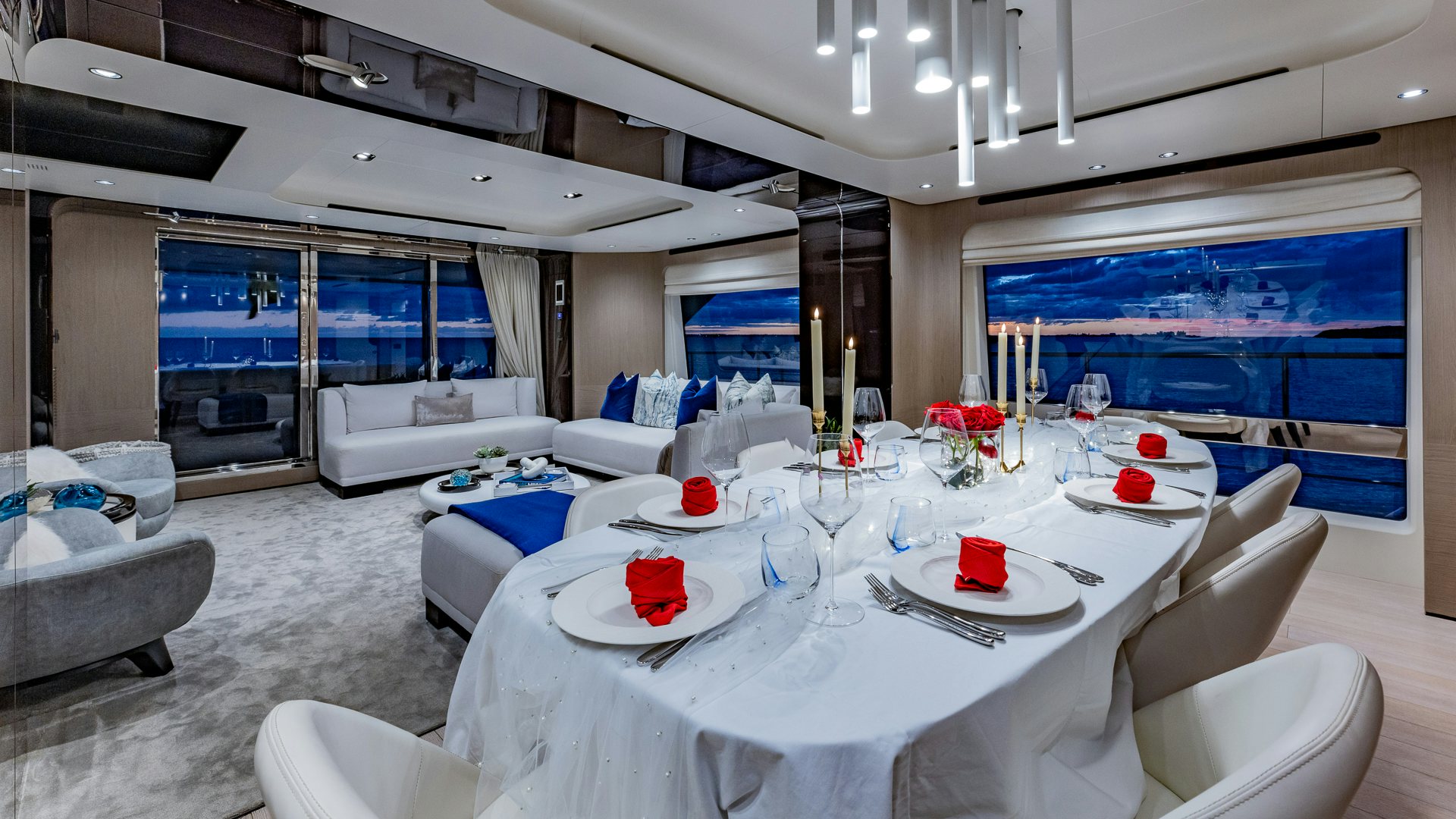 a room with a table chairs and a window aboard PIER PRESSURE Yacht for Charter