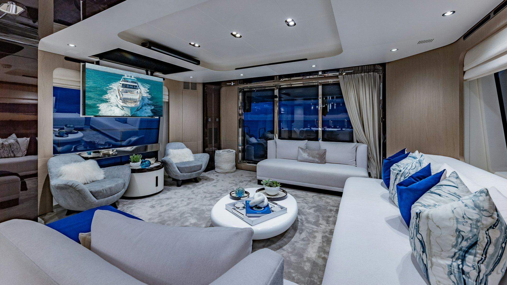 a living room with a large screen aboard PIER PRESSURE Yacht for Charter