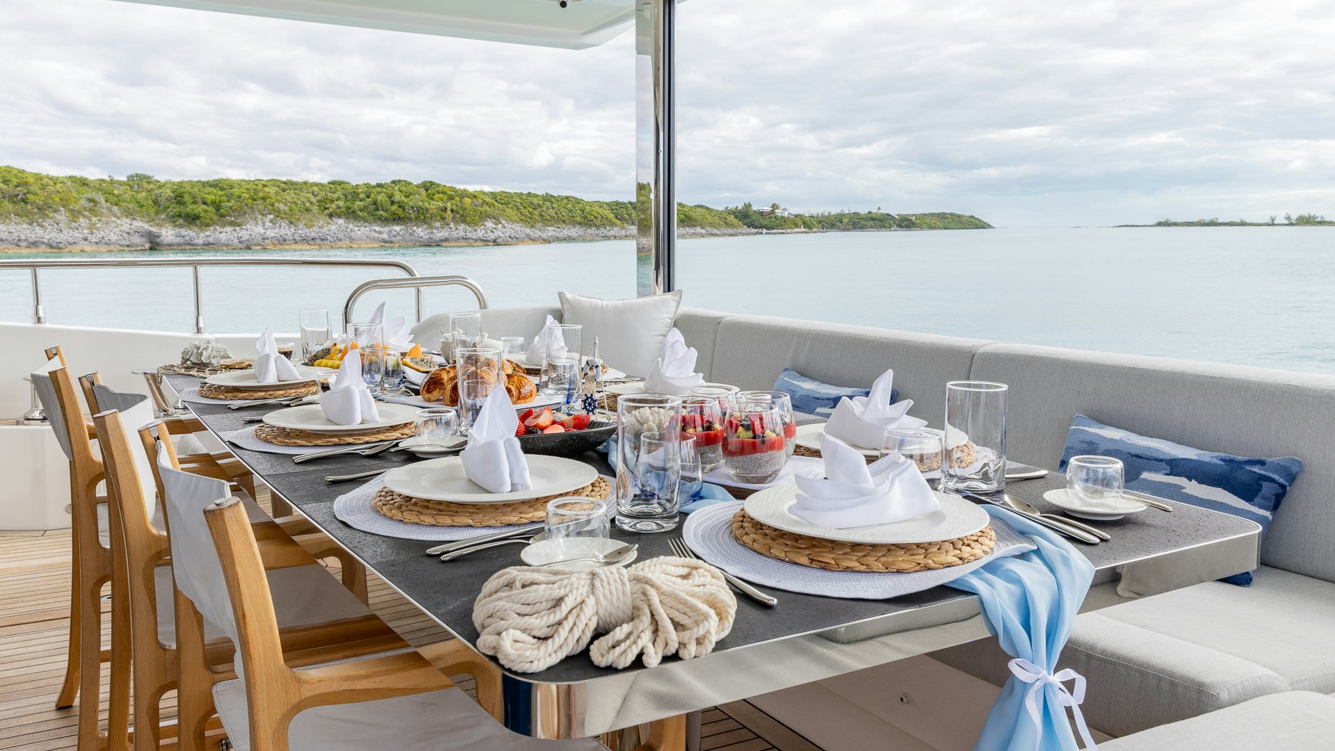 a table set for a dinner aboard PIER PRESSURE Yacht for Charter