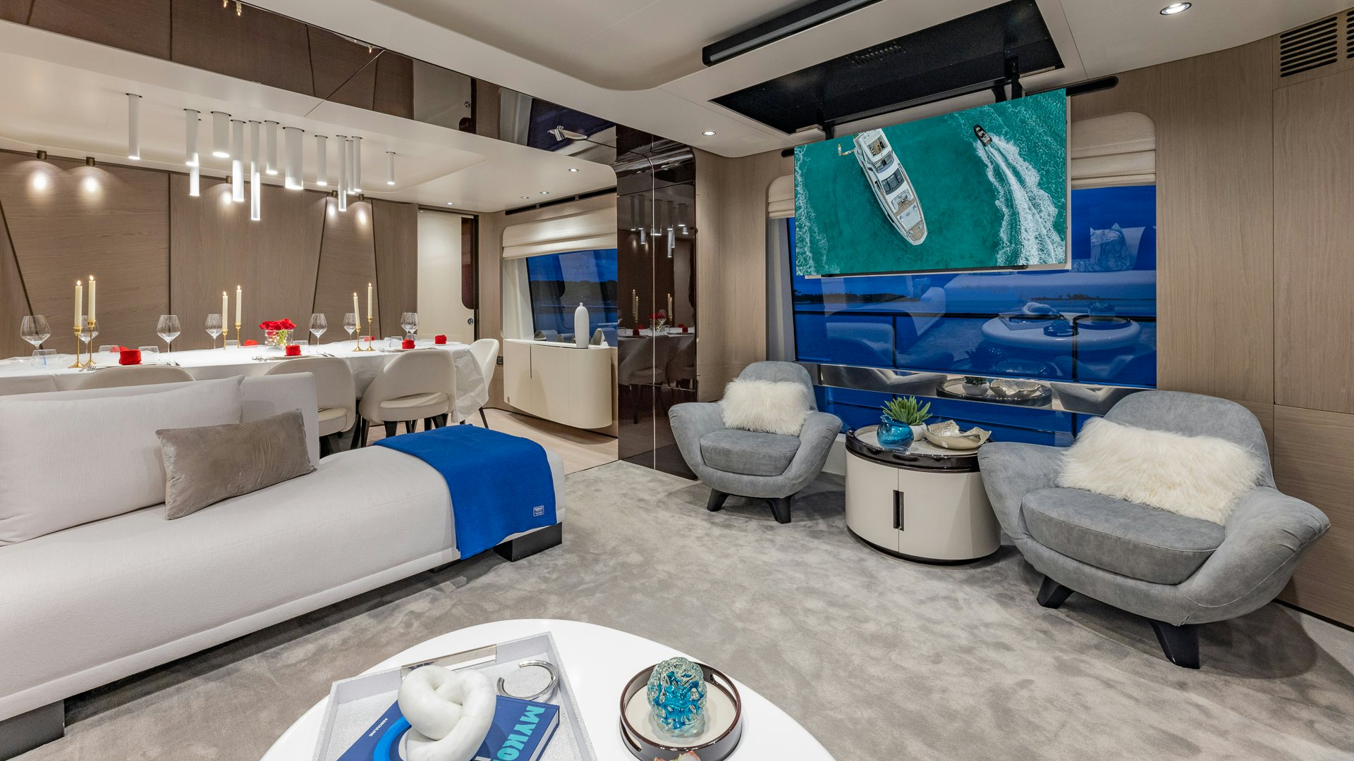a room with a couch and a table and chairs aboard PIER PRESSURE Yacht for Charter
