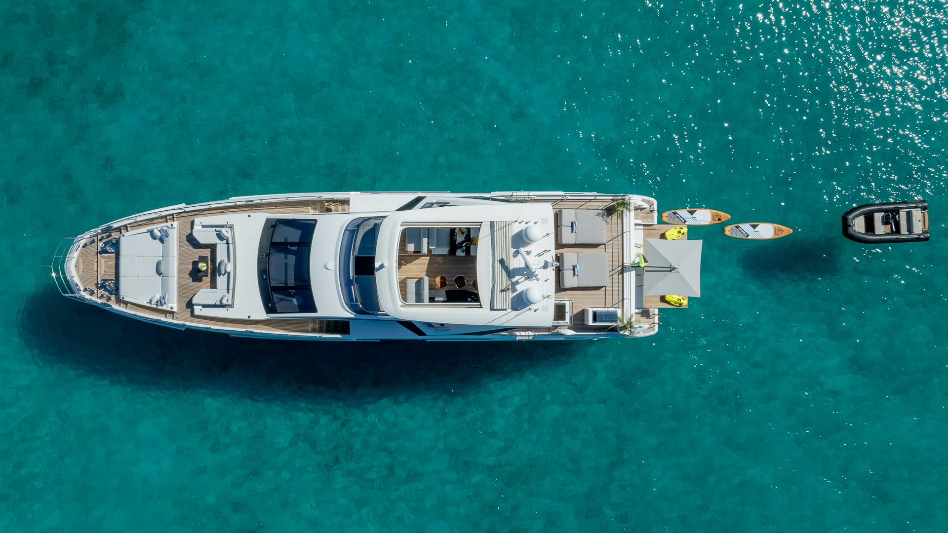 a helicopter flying over a body of water aboard PIER PRESSURE Yacht for Charter