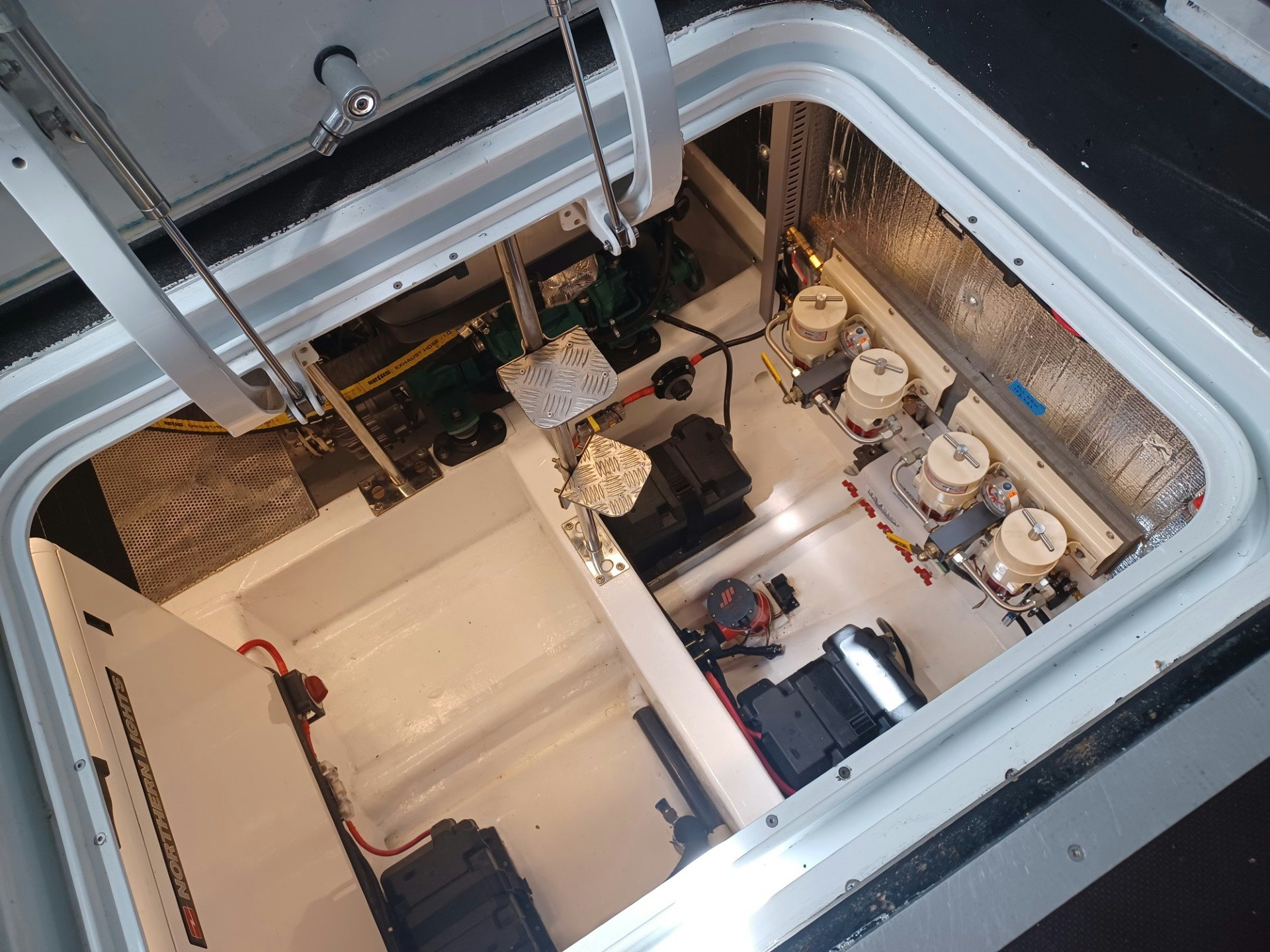 a group of people sitting at a table with wine glasses aboard TARA Yacht for Sale