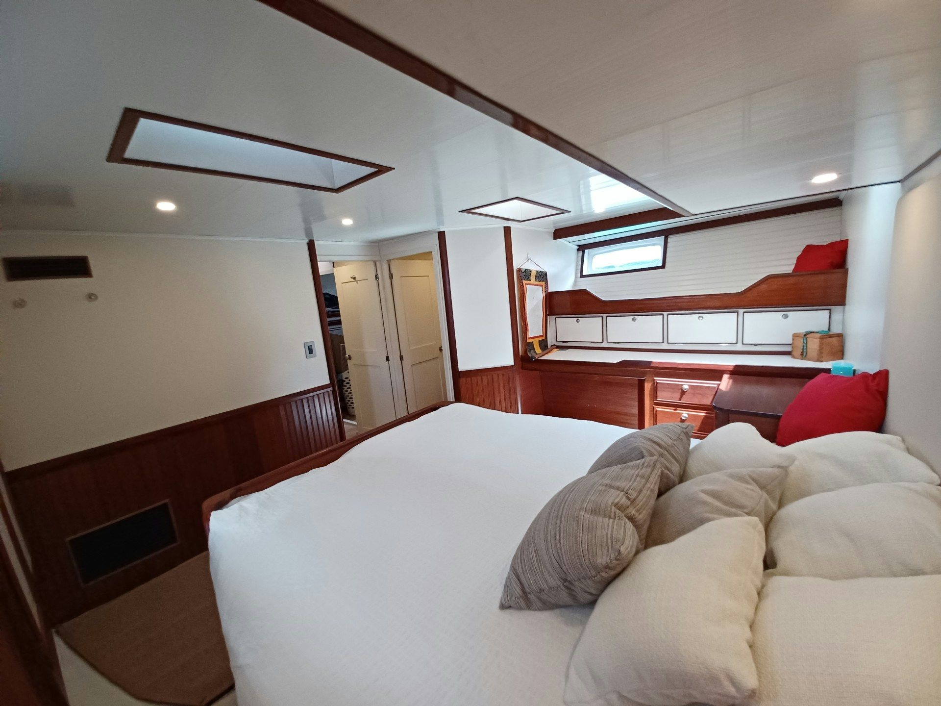 a room with a couch and a bed aboard TARA Yacht for Sale