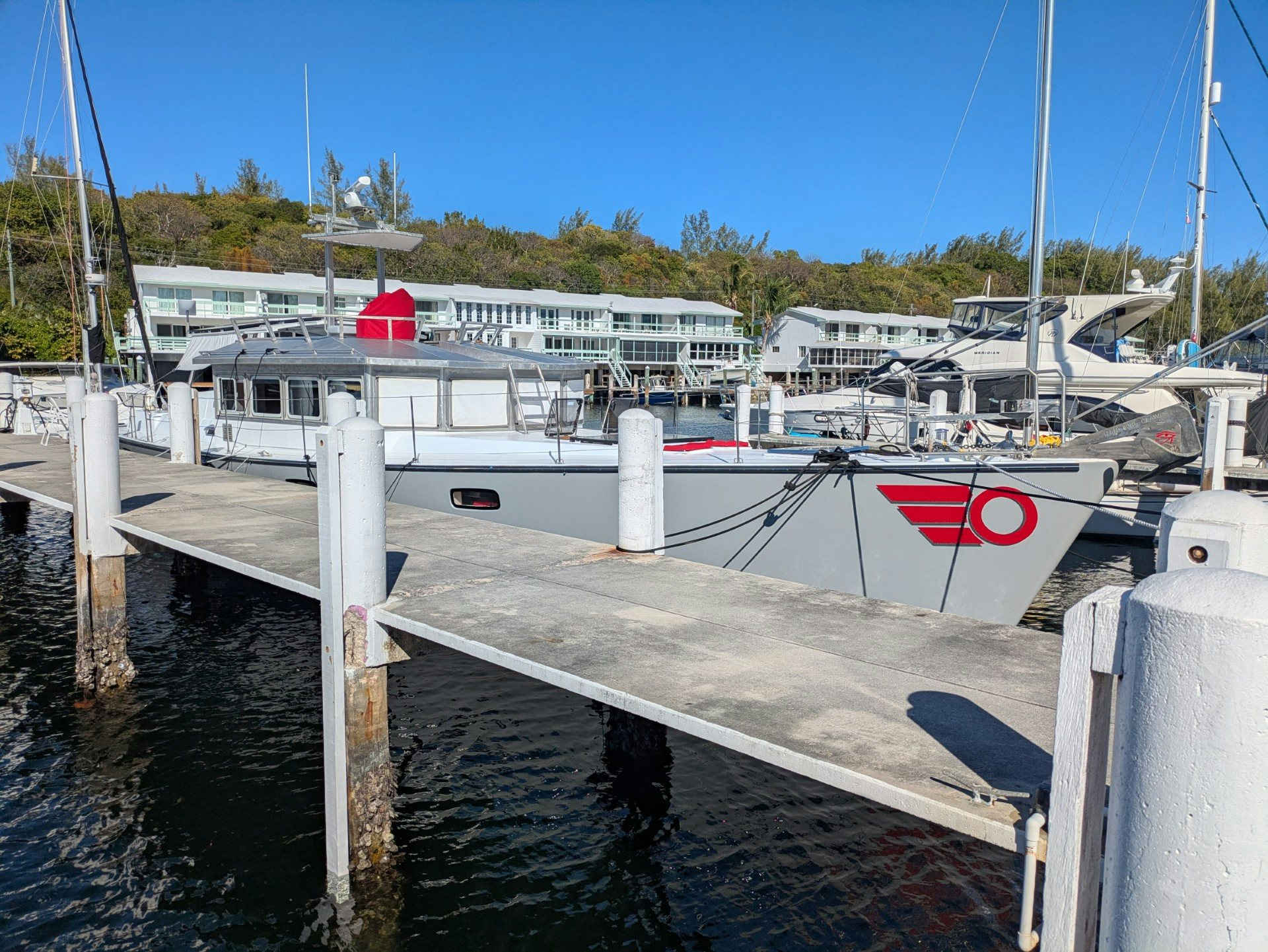 a boat docked at a pier aboard TARA Yacht for Sale