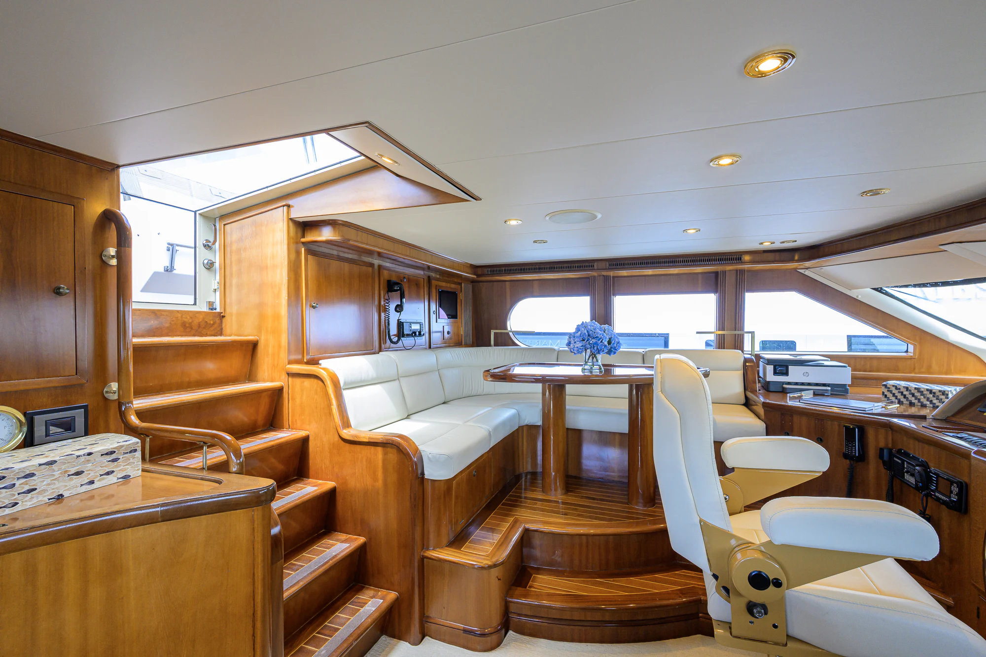 a room with a couch and a table and chairs aboard MARBELLA IV Yacht for Sale