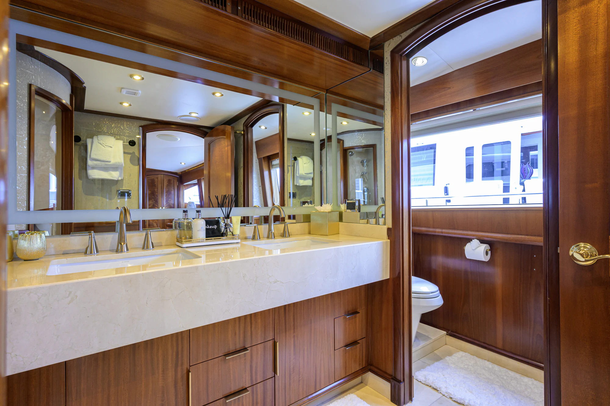 a bathroom with a large mirror aboard MARBELLA IV Yacht for Sale