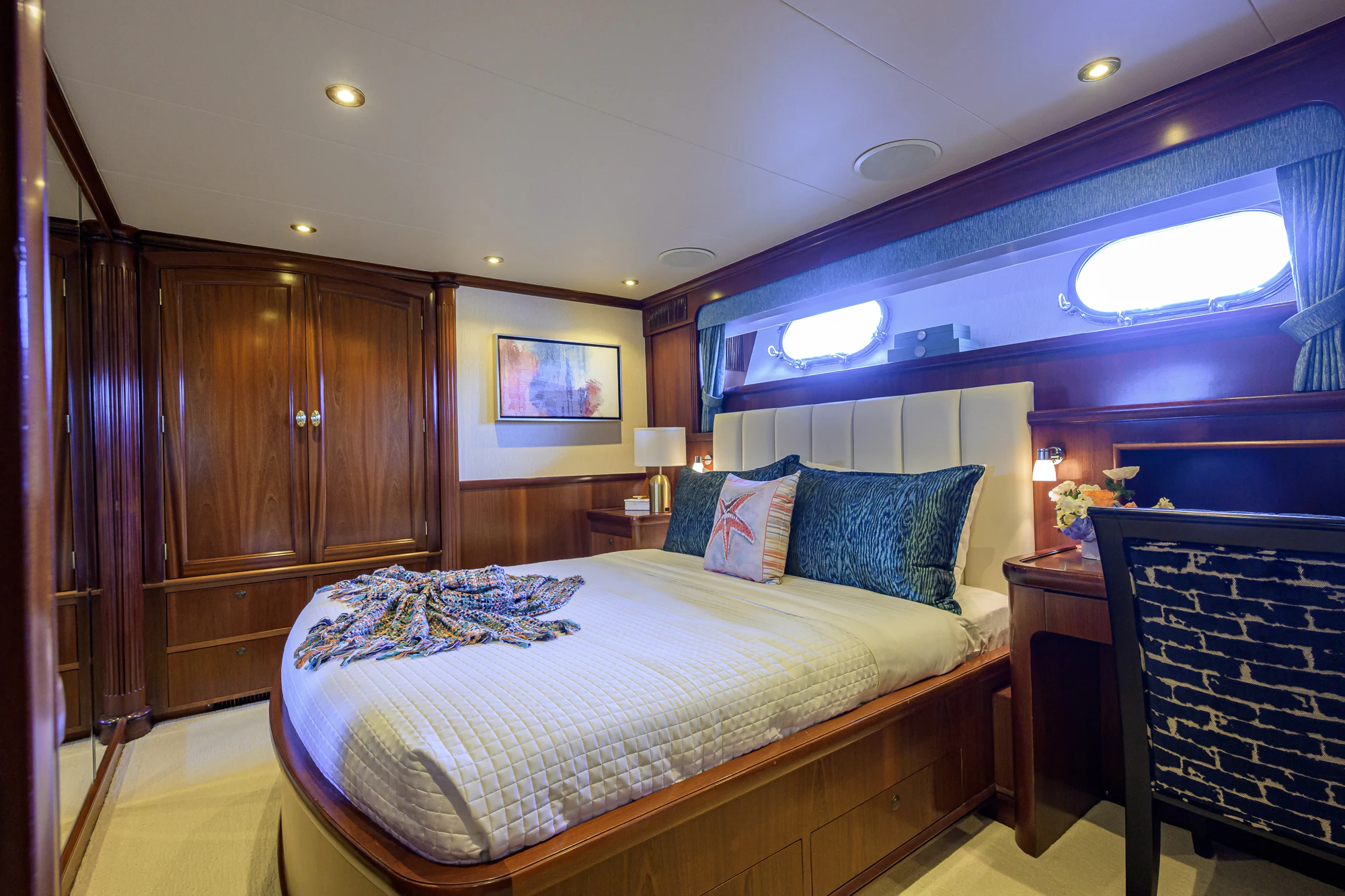 a bed in a room aboard MARBELLA IV Yacht for Sale