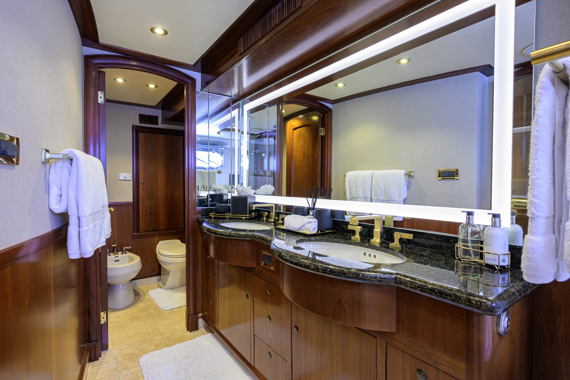 a bathroom with a large mirror aboard MARBELLA IV Yacht for Sale