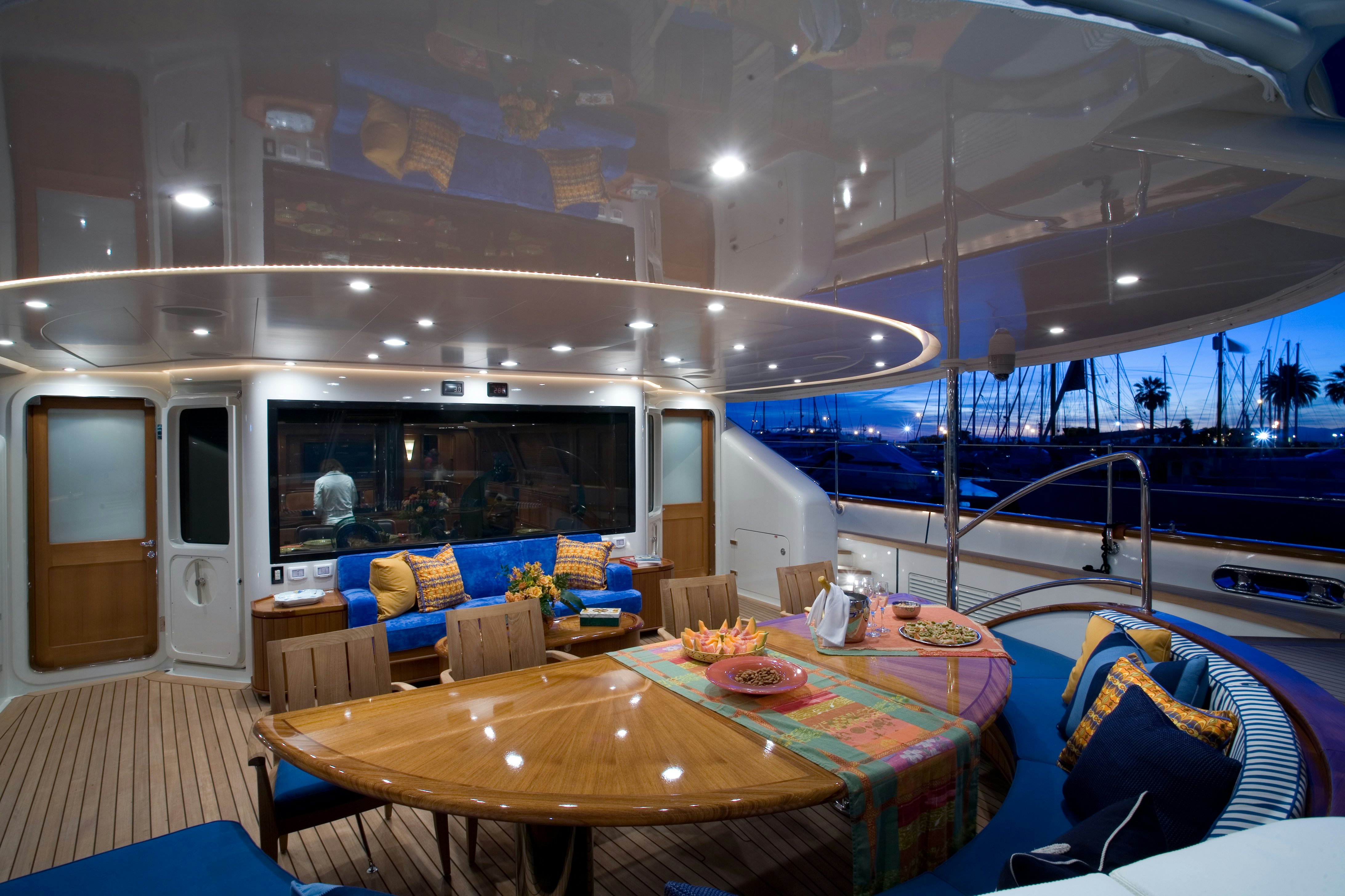 a large living room with a large pool table and chairs aboard TAMSEN Yacht for Sale