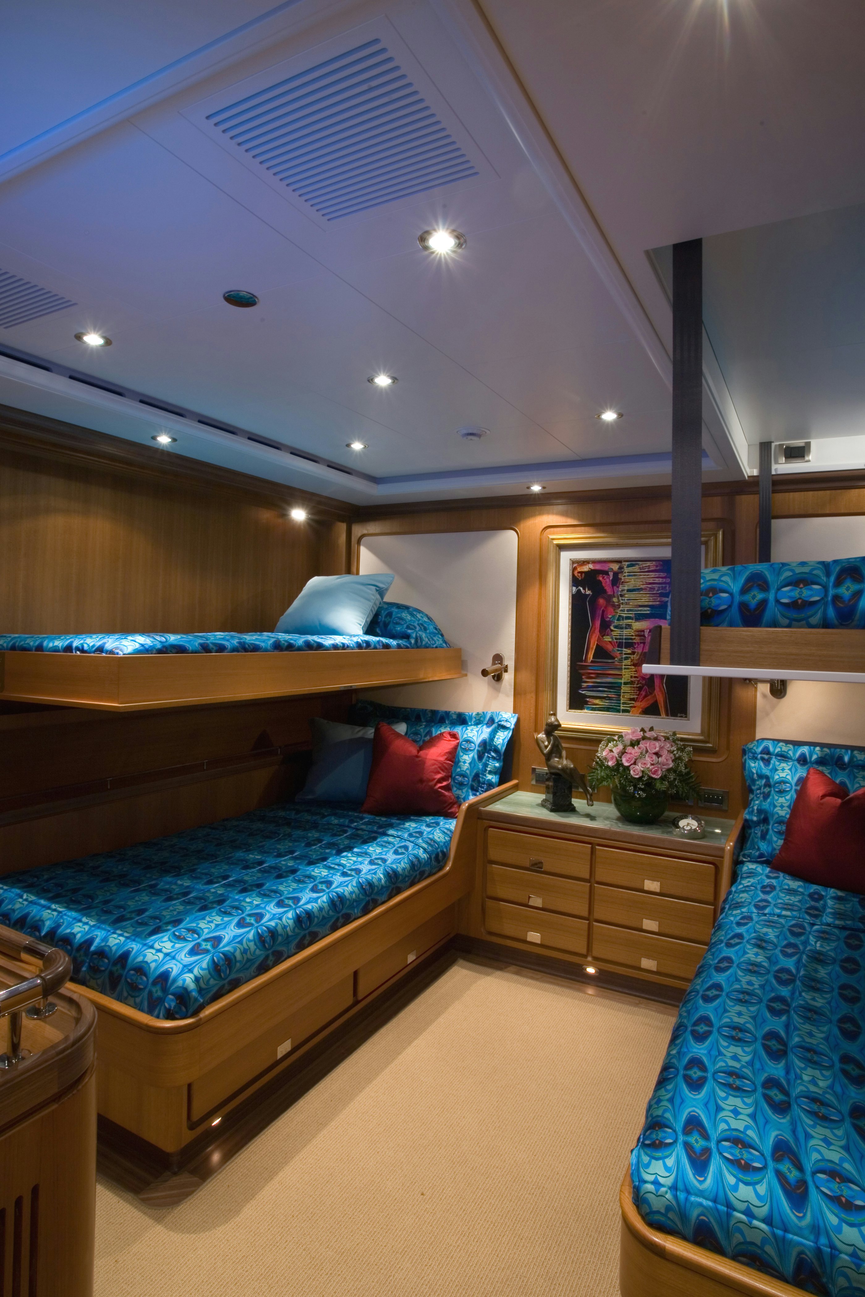 a bedroom with a blue bed aboard TAMSEN Yacht for Sale