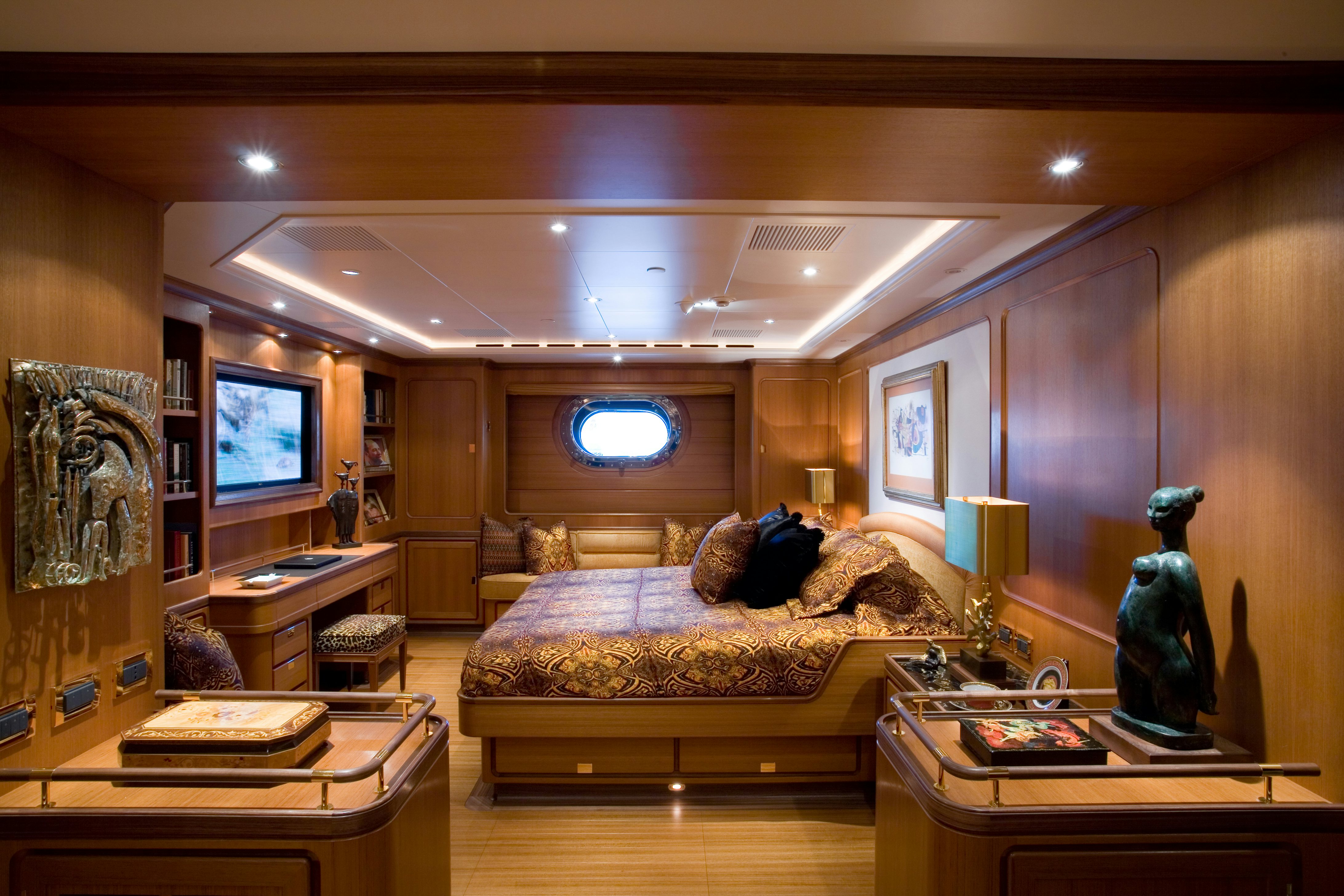 a living room with a large mirror aboard TAMSEN Yacht for Sale
