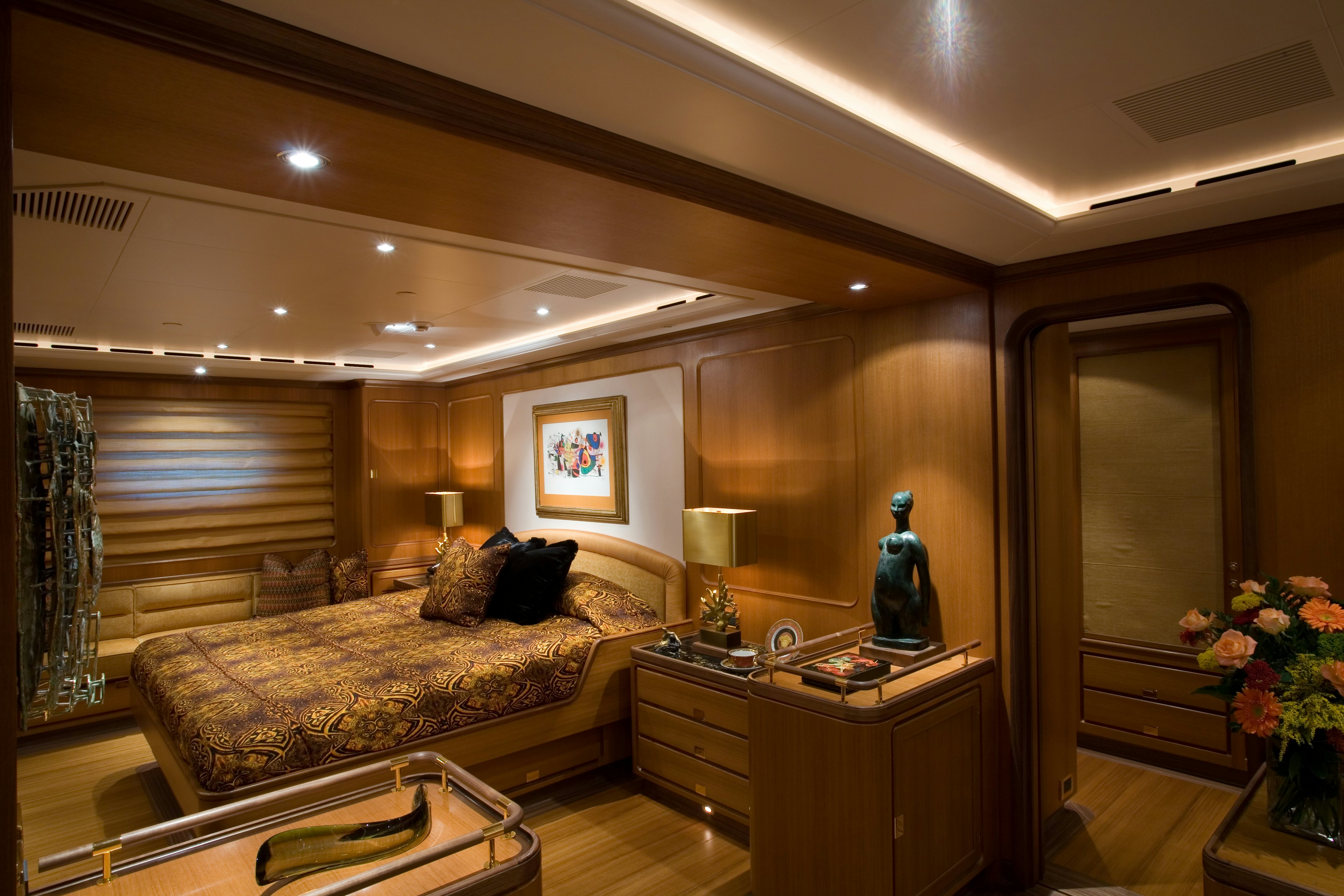 a living room with a couch and a large window aboard TAMSEN Yacht for Sale