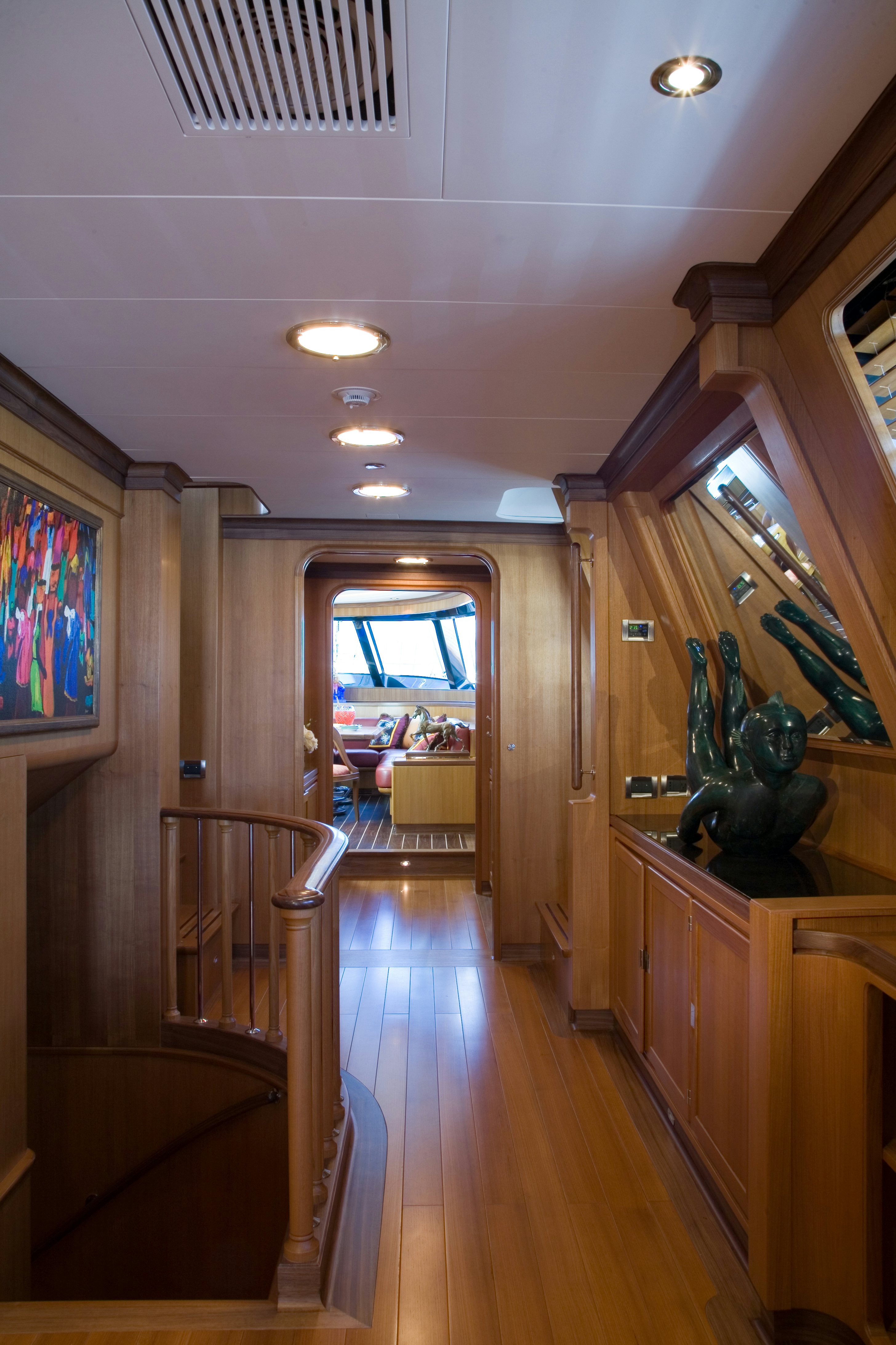 a hallway with wood floors and wood cabinets aboard TAMSEN Yacht for Sale