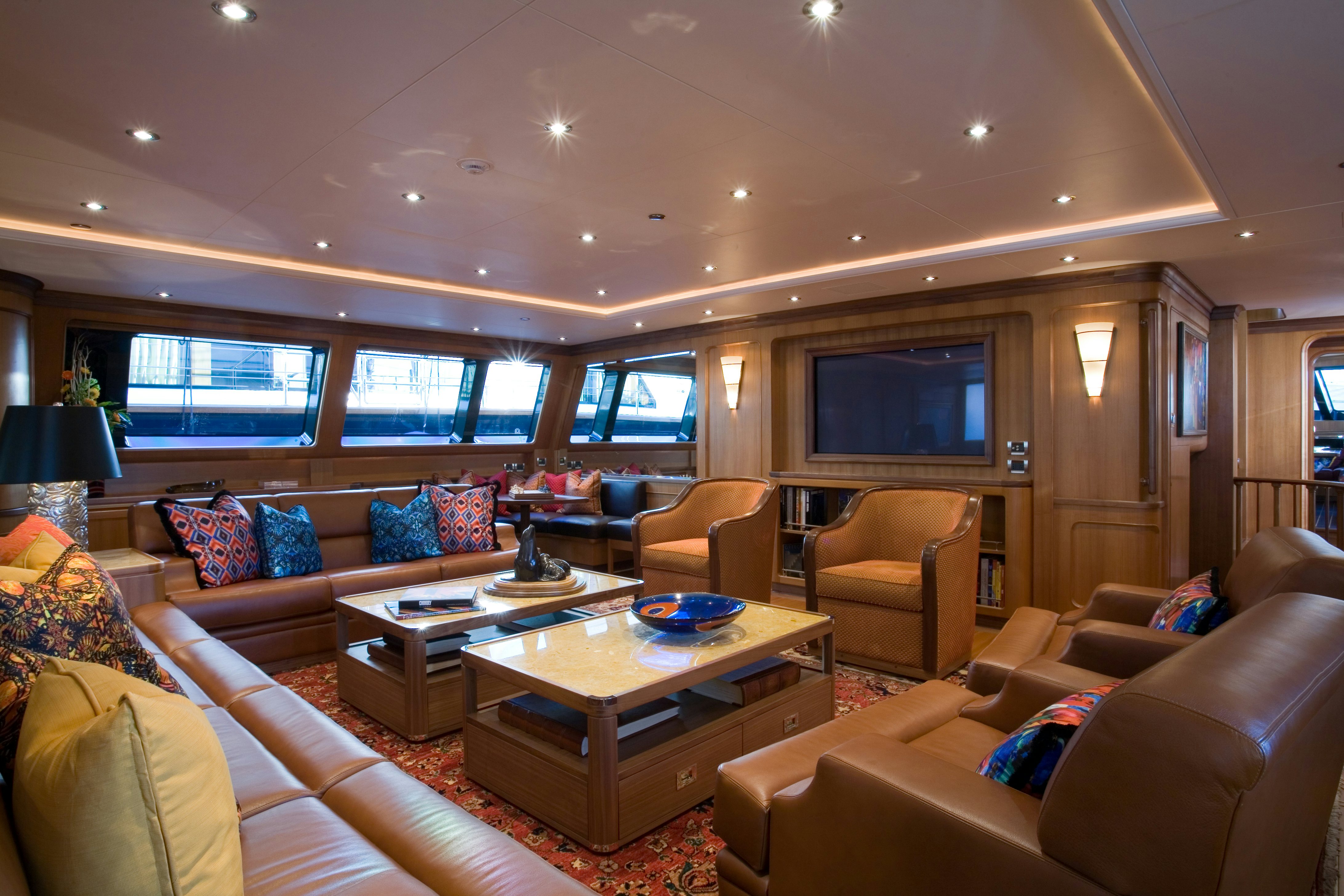 a living room with a large screen aboard TAMSEN Yacht for Sale