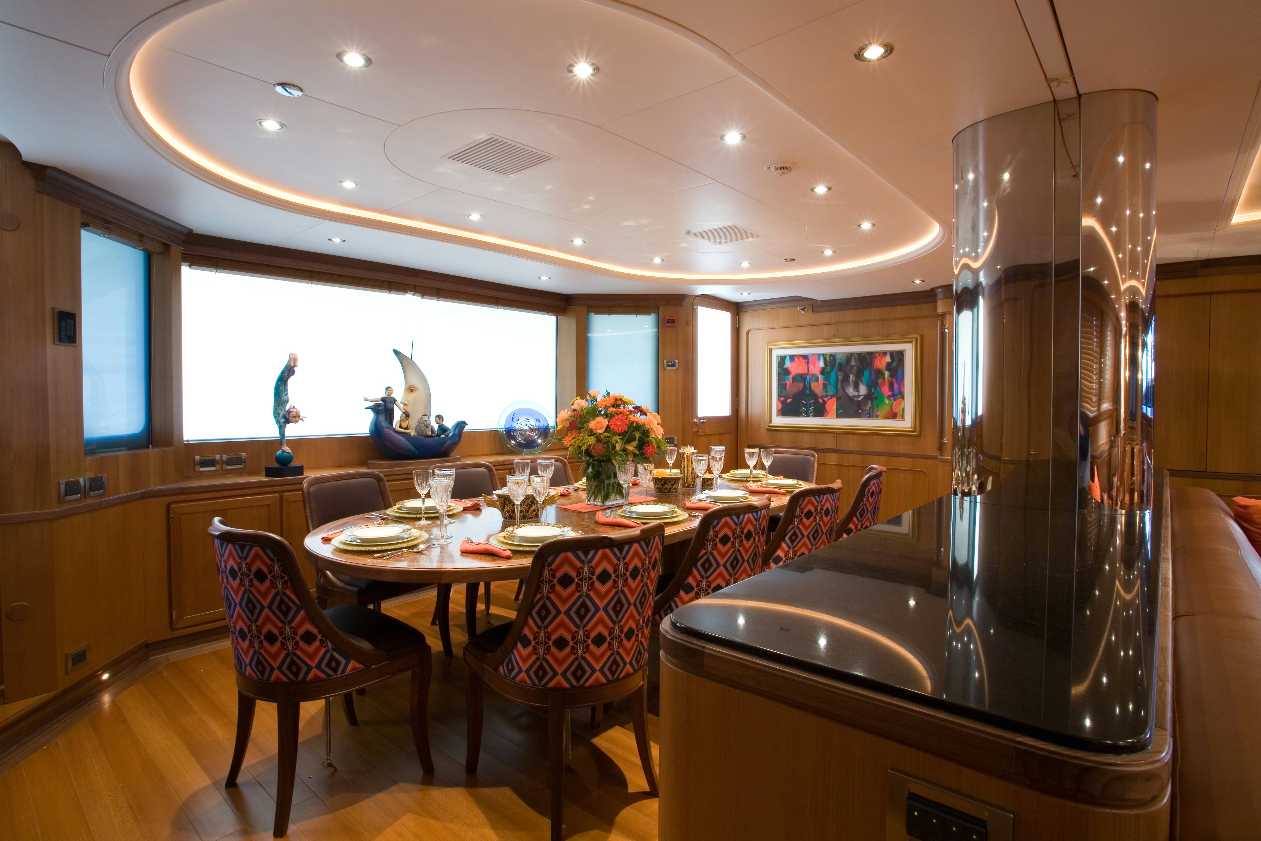 a dining room with a large table aboard TAMSEN Yacht for Sale