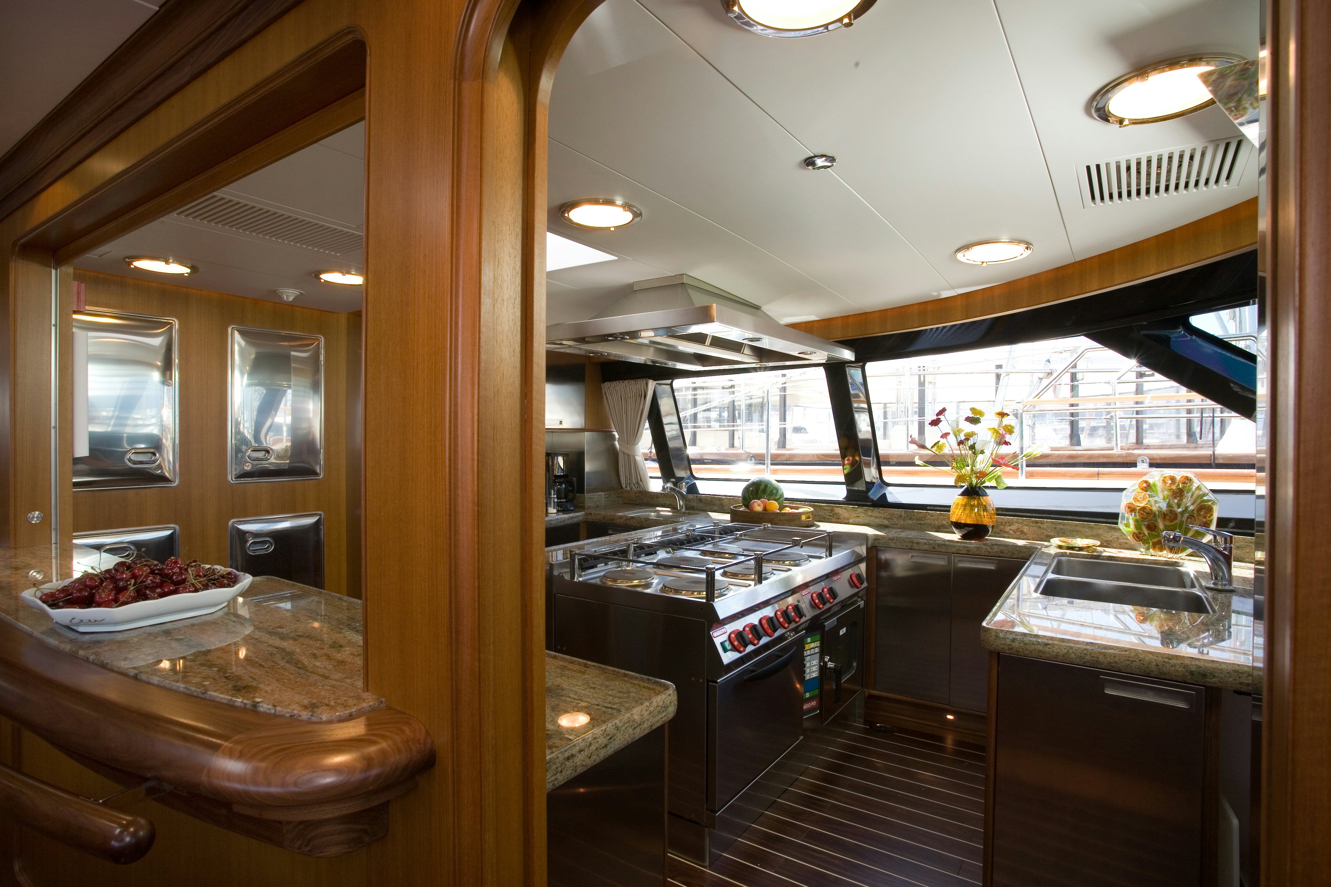 a kitchen with a countertop sink and cabinets aboard TAMSEN Yacht for Sale