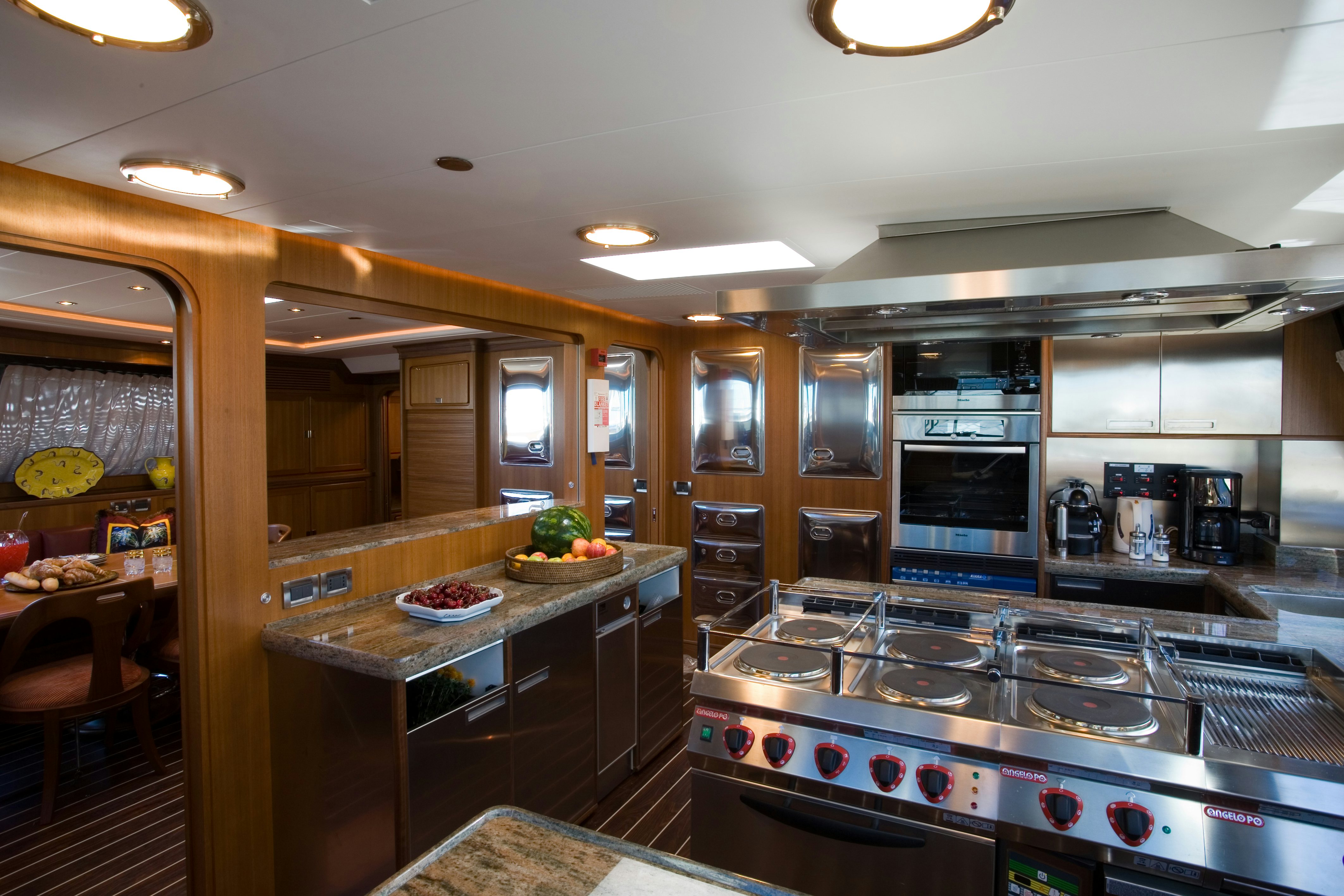 a kitchen with a large island aboard TAMSEN Yacht for Sale