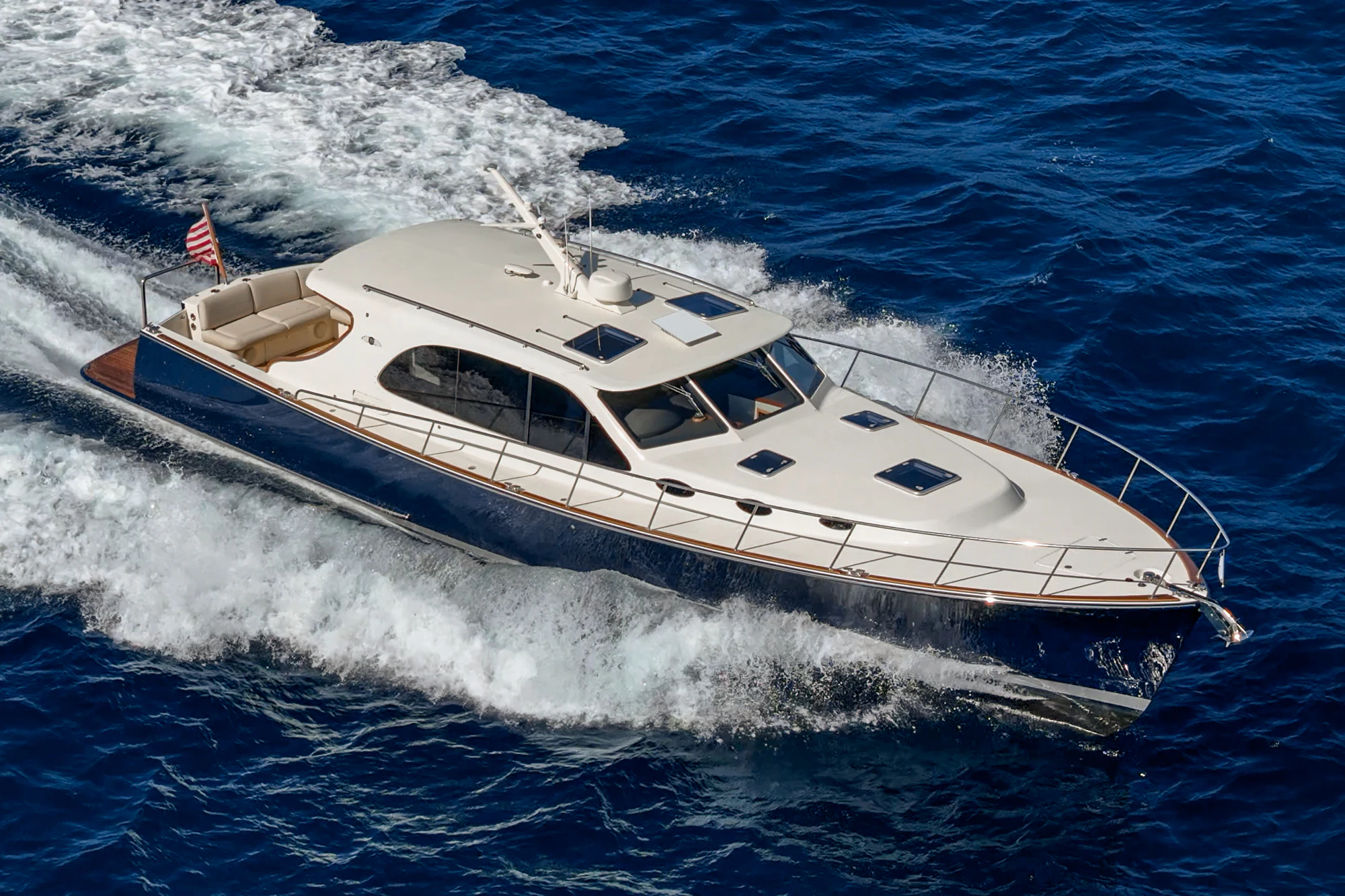 a white yacht on the water aboard PIPE DREAM Yacht for Sale