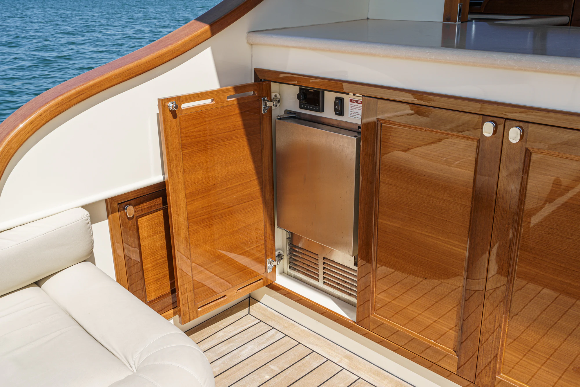 a boat with a wood door aboard PIPE DREAM Yacht for Sale