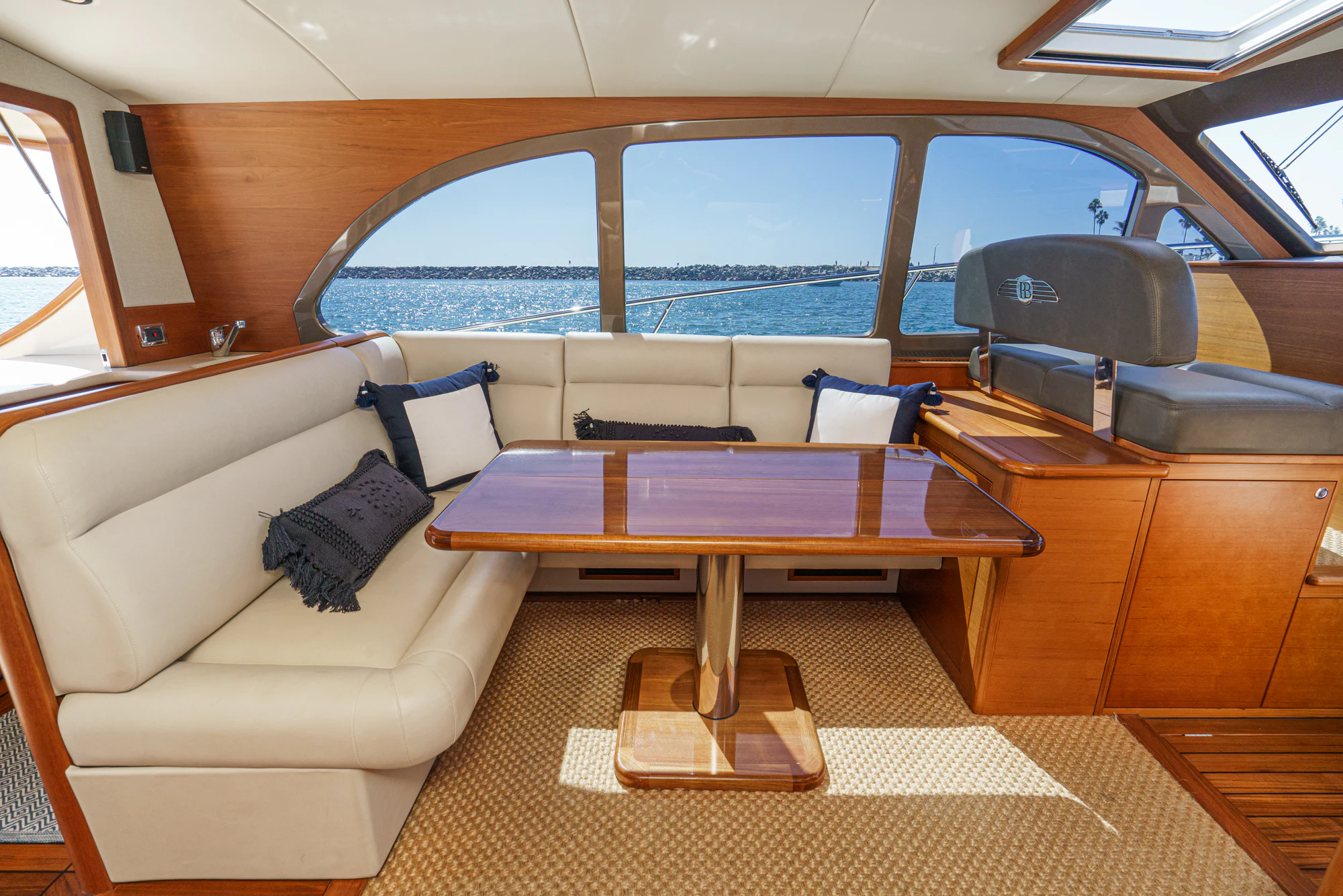 a living room with a couch and a table aboard PIPE DREAM Yacht for Sale