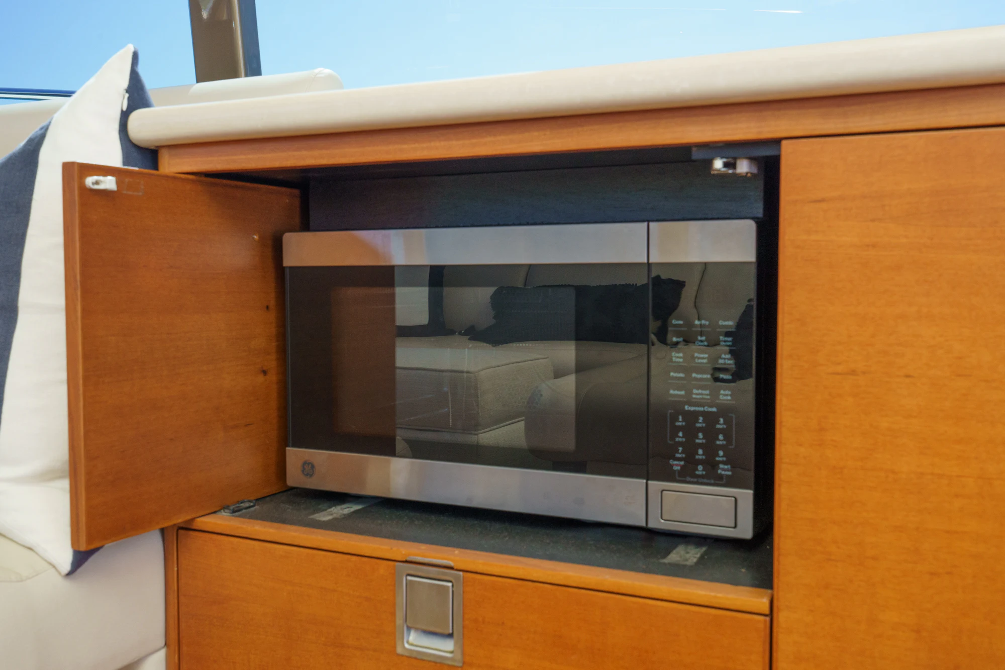 a microwave oven on a table aboard PIPE DREAM Yacht for Sale