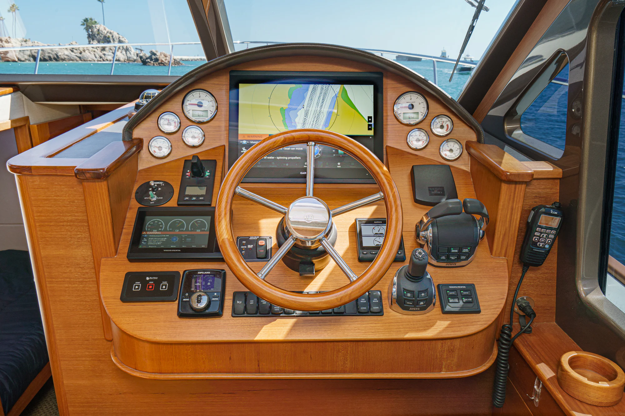 a wooden panel with a compass aboard PIPE DREAM Yacht for Sale