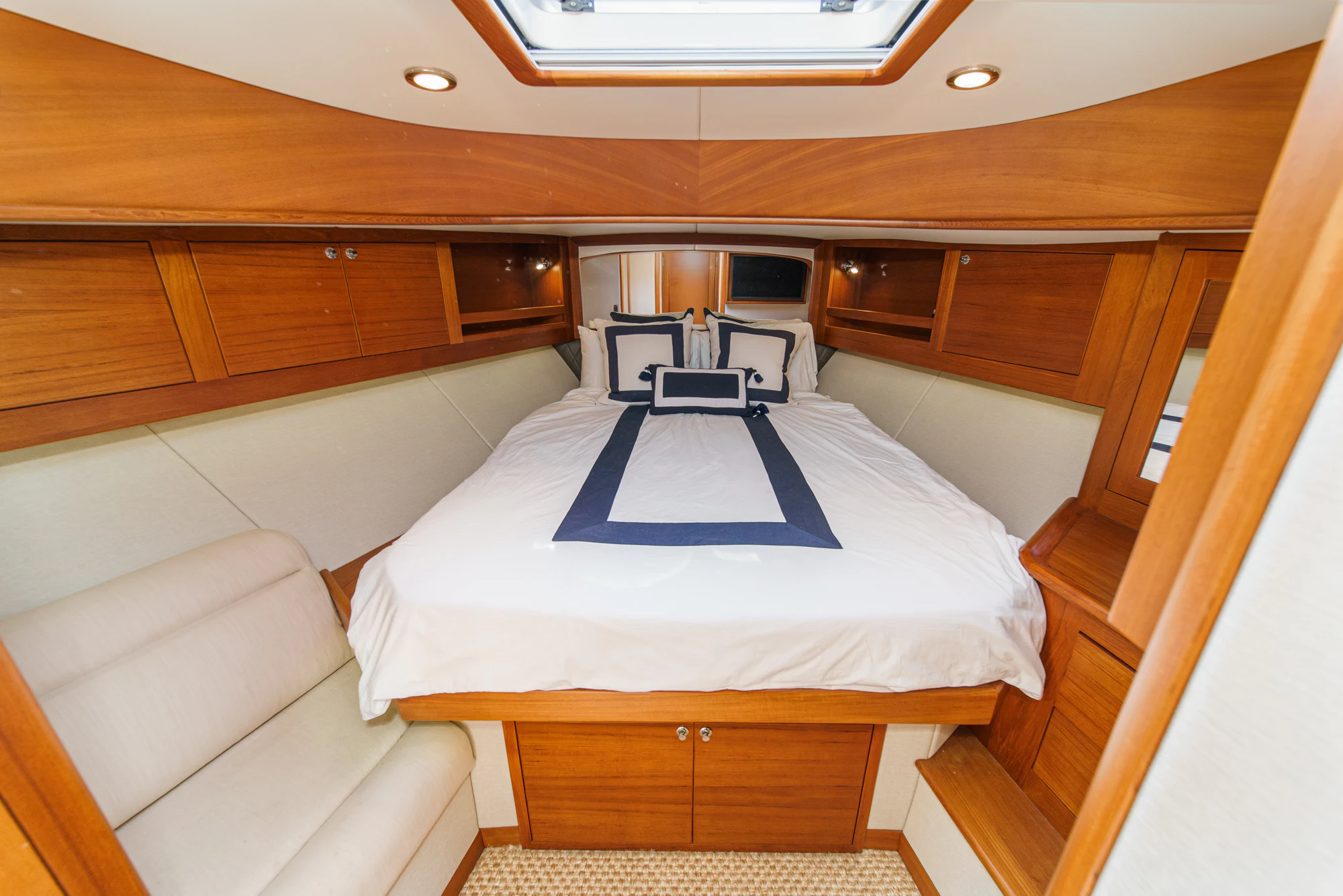 a room with a bed and a couch aboard PIPE DREAM Yacht for Sale
