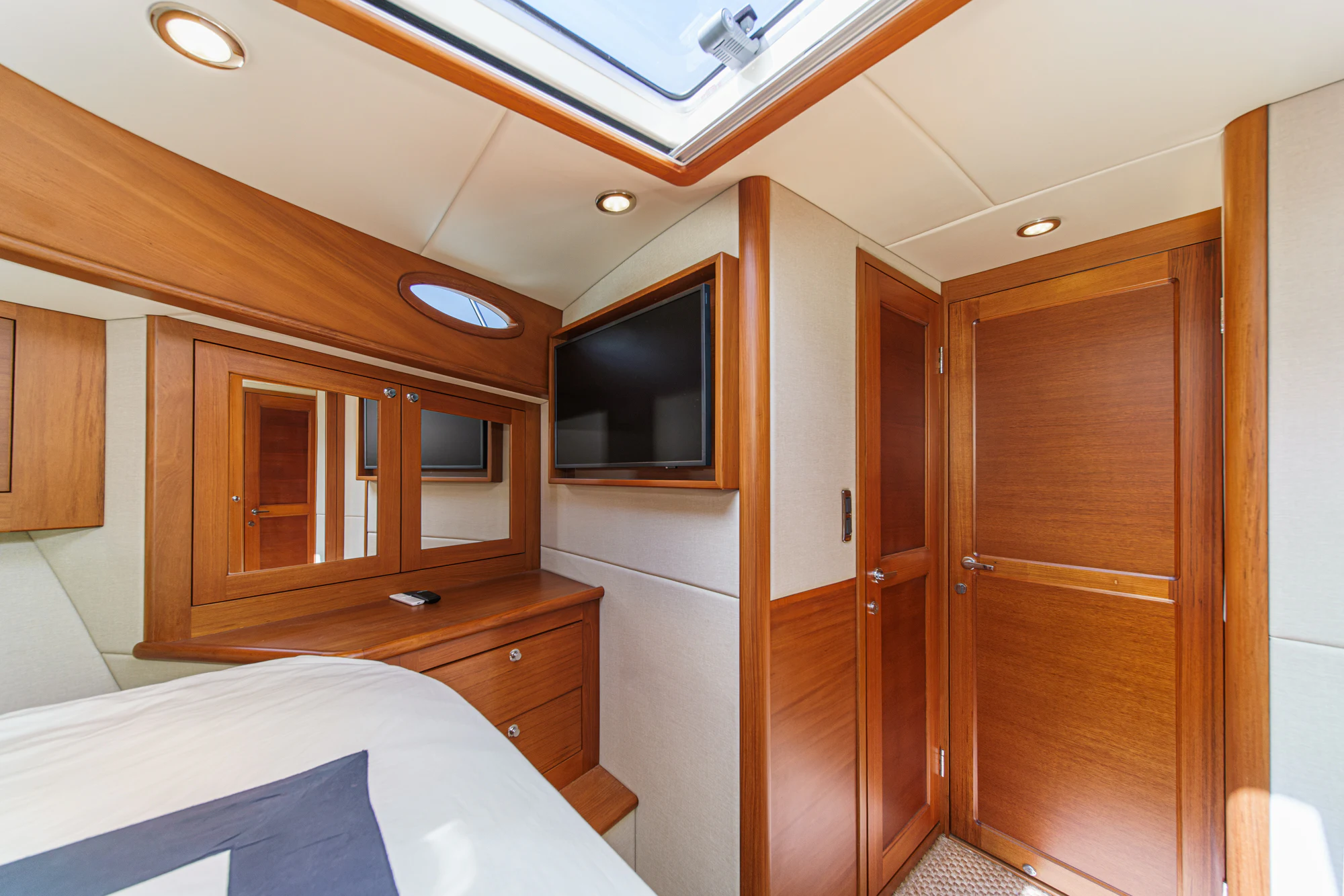 a room with wooden cabinets aboard PIPE DREAM Yacht for Sale