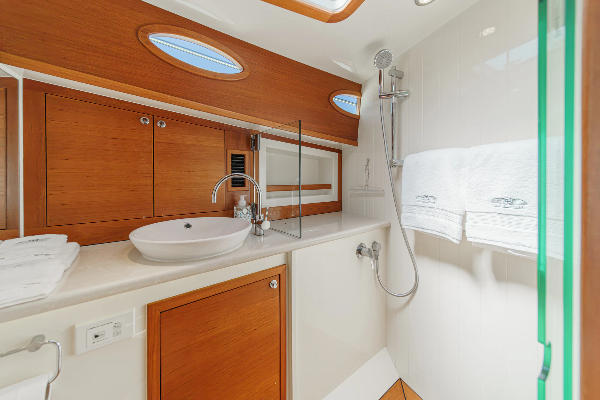 a bathroom with a sink and a shower aboard PIPE DREAM Yacht for Sale