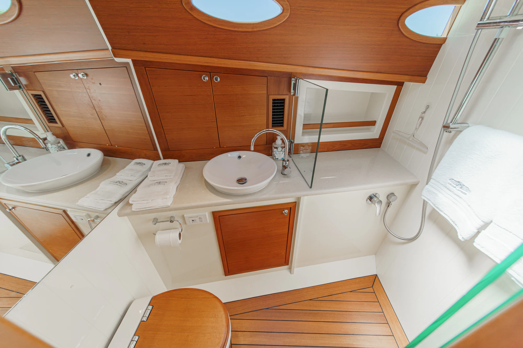a bathroom with a sink and a toilet aboard PIPE DREAM Yacht for Sale