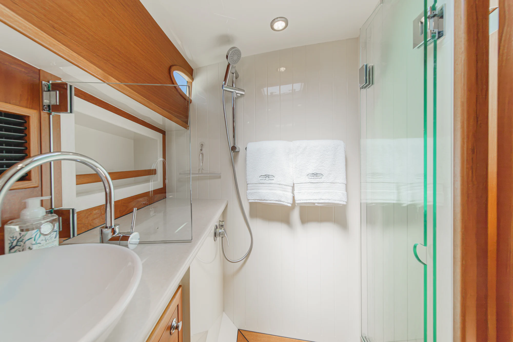 a bathroom with a shower and sink aboard PIPE DREAM Yacht for Sale