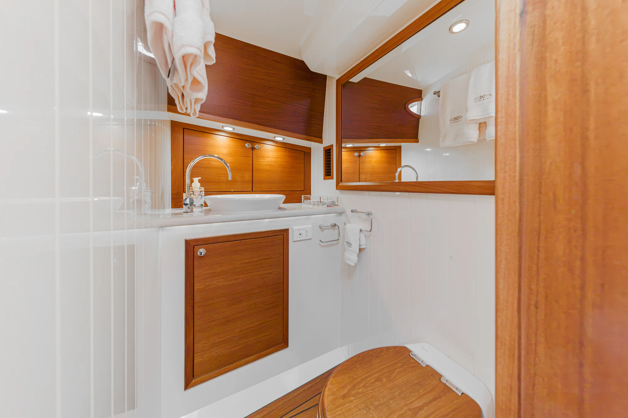 a bathroom with a sink and a mirror aboard PIPE DREAM Yacht for Sale