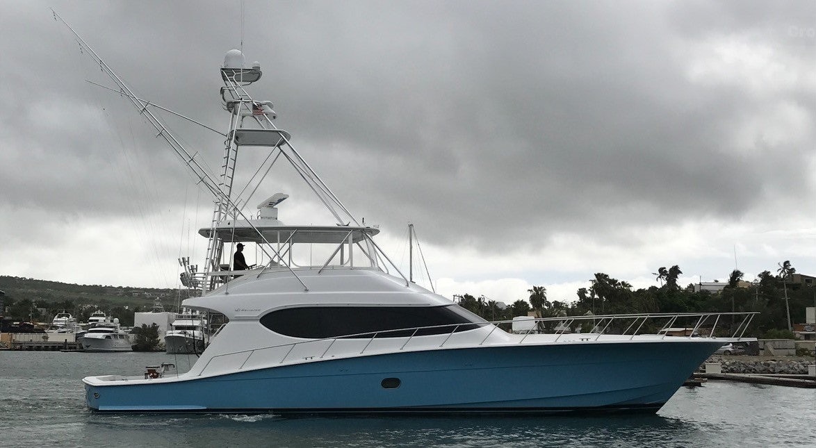a large white boat in the water aboard TRUE GRIT Yacht for Sale