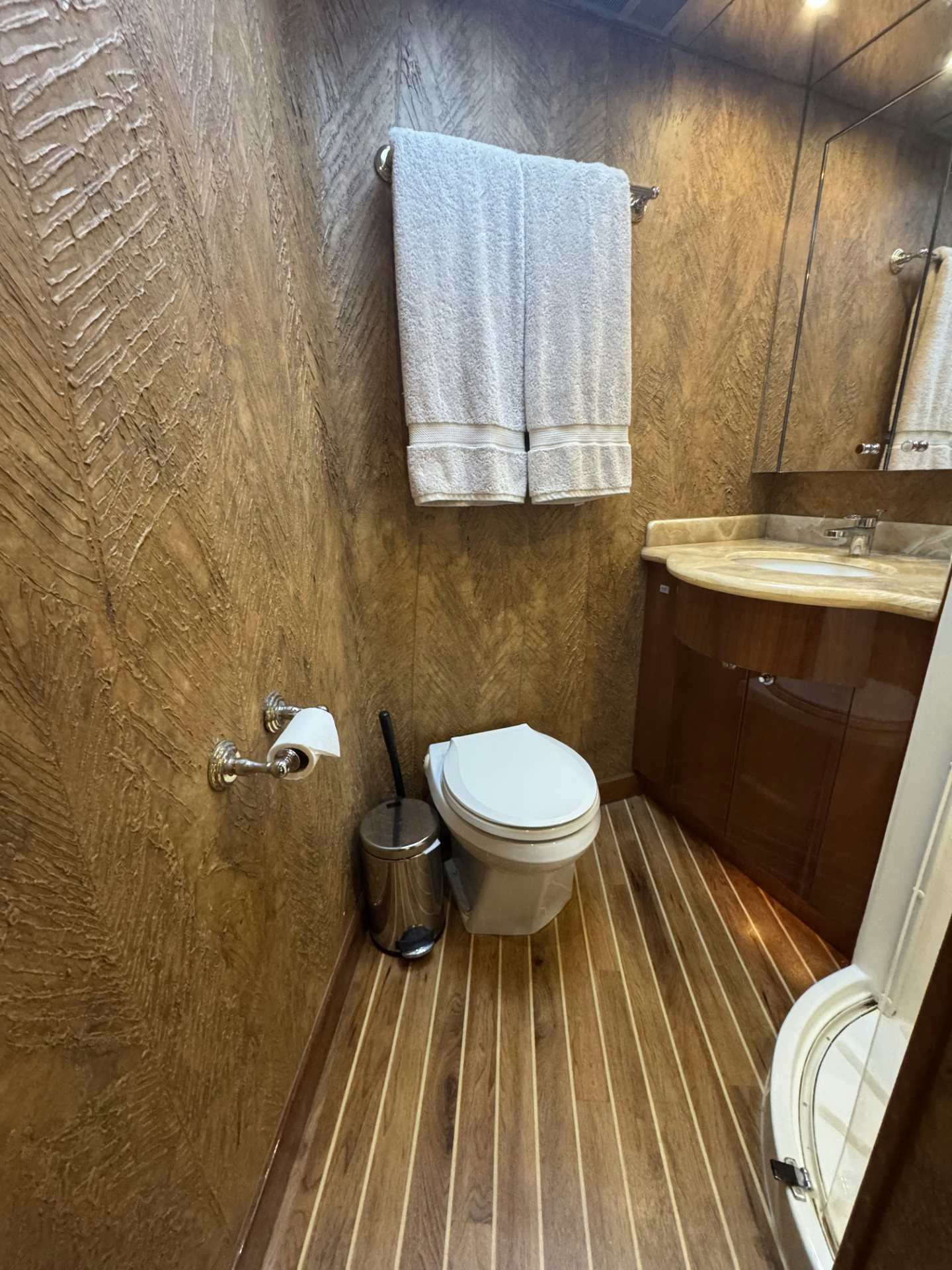 a bathroom with a toilet and sink aboard TRUE GRIT Yacht for Sale