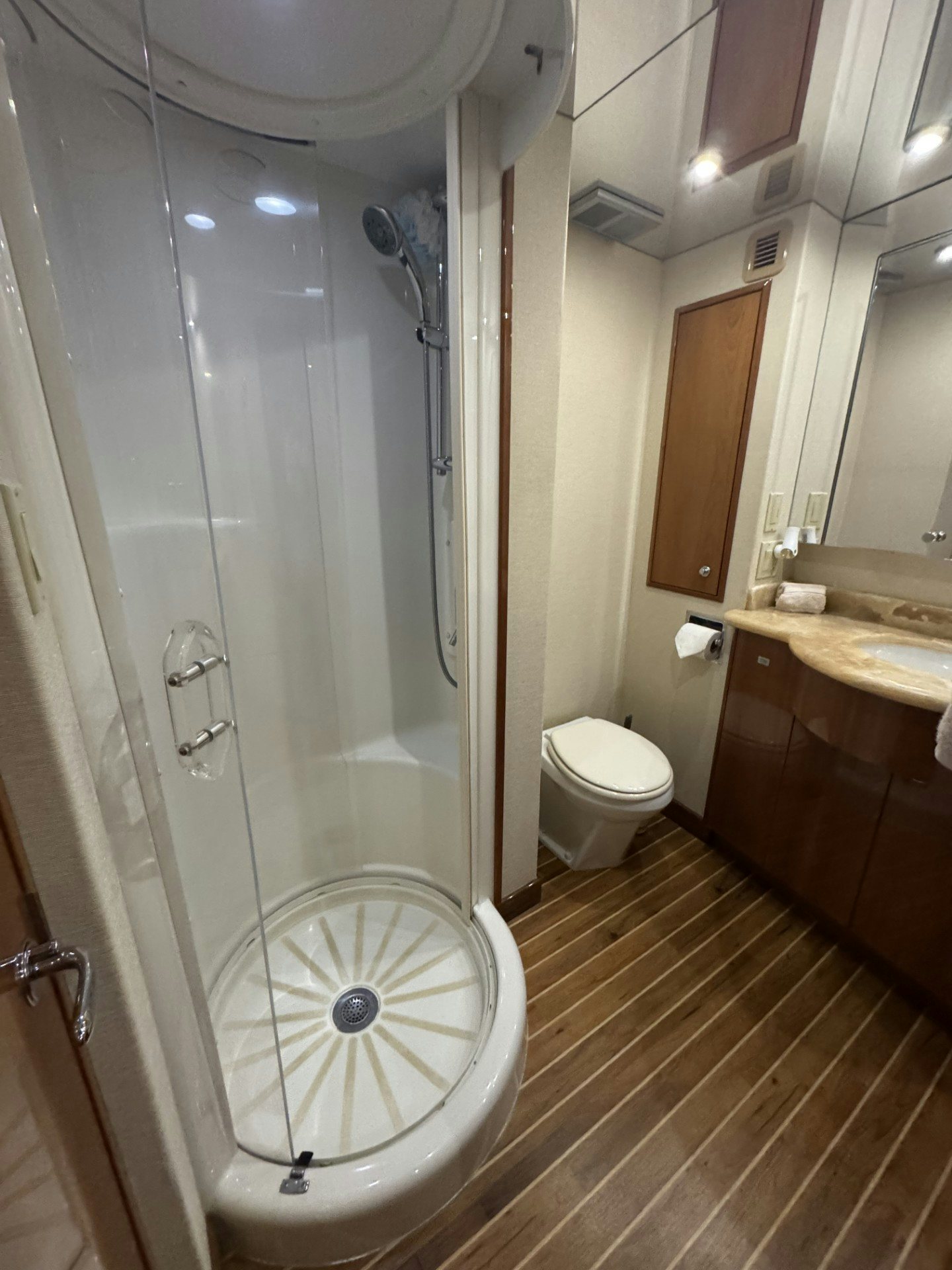 a bathroom with a shower and toilet aboard TRUE GRIT Yacht for Sale