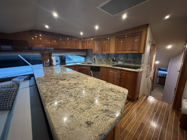 a large kitchen with a large marble counter top aboard TRUE GRIT Yacht for Sale
