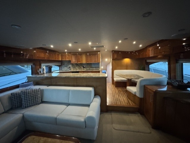 a room with a couch and a television aboard TRUE GRIT Yacht for Sale