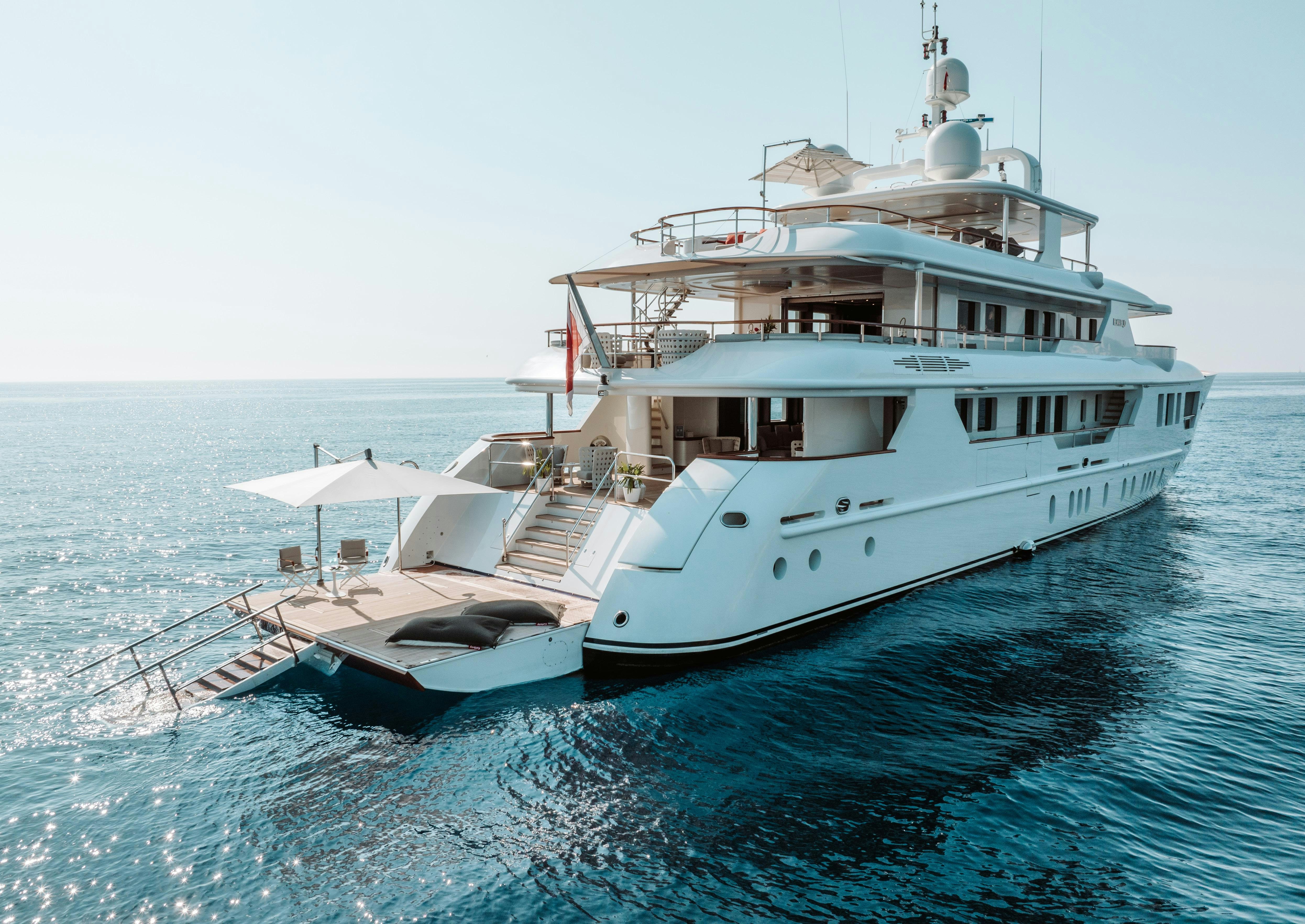 a large white boat in the water aboard HEMABEJO Yacht for Charter