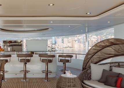 a room with a couch and chairs aboard HEMABEJO Yacht for Charter