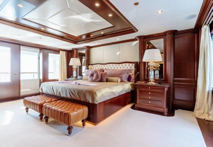 a large bedroom with a large bed aboard HEMABEJO Yacht for Charter