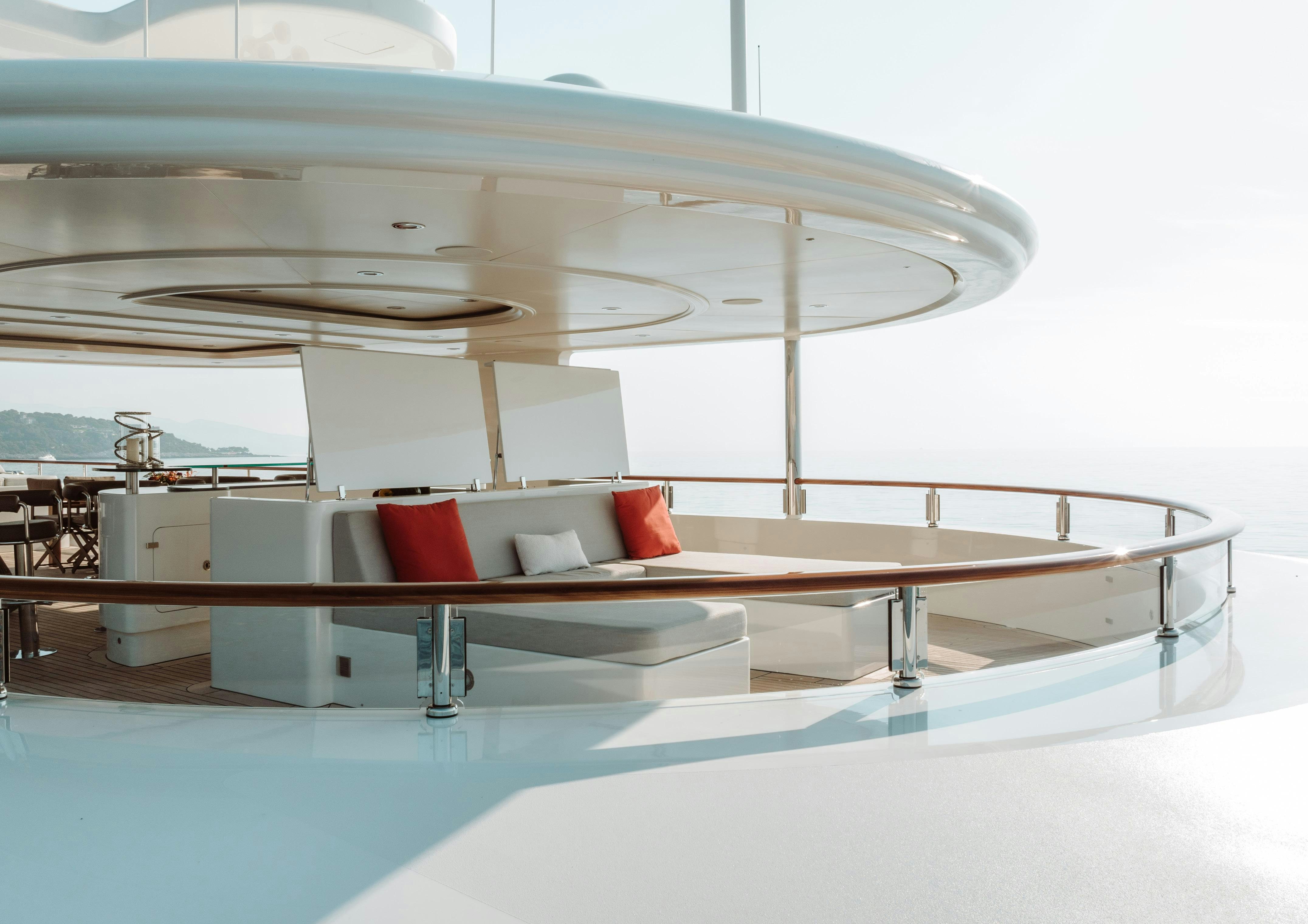a white room with a white table and chairs aboard HEMABEJO Yacht for Charter