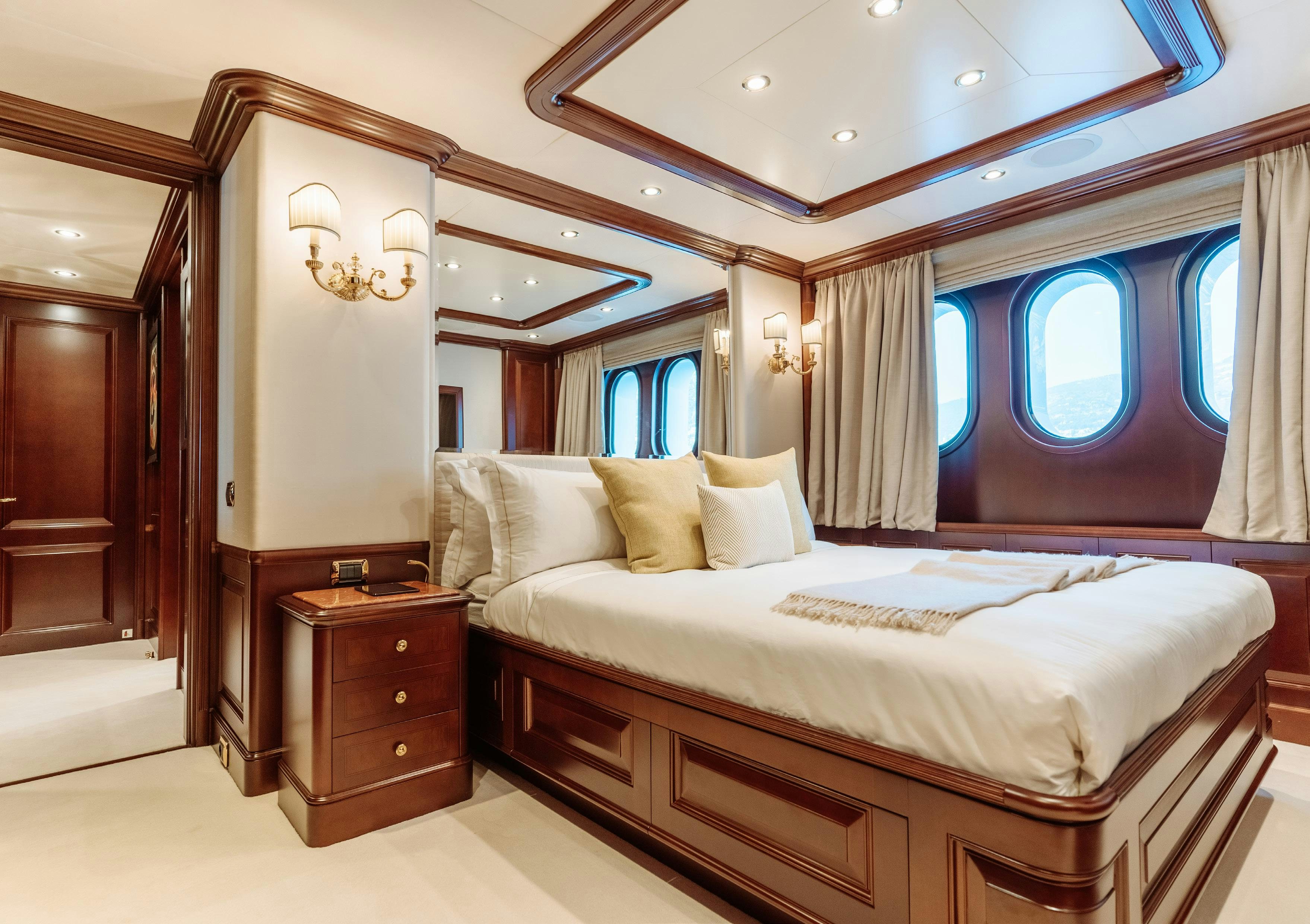 a bed in a room aboard HEMABEJO Yacht for Charter