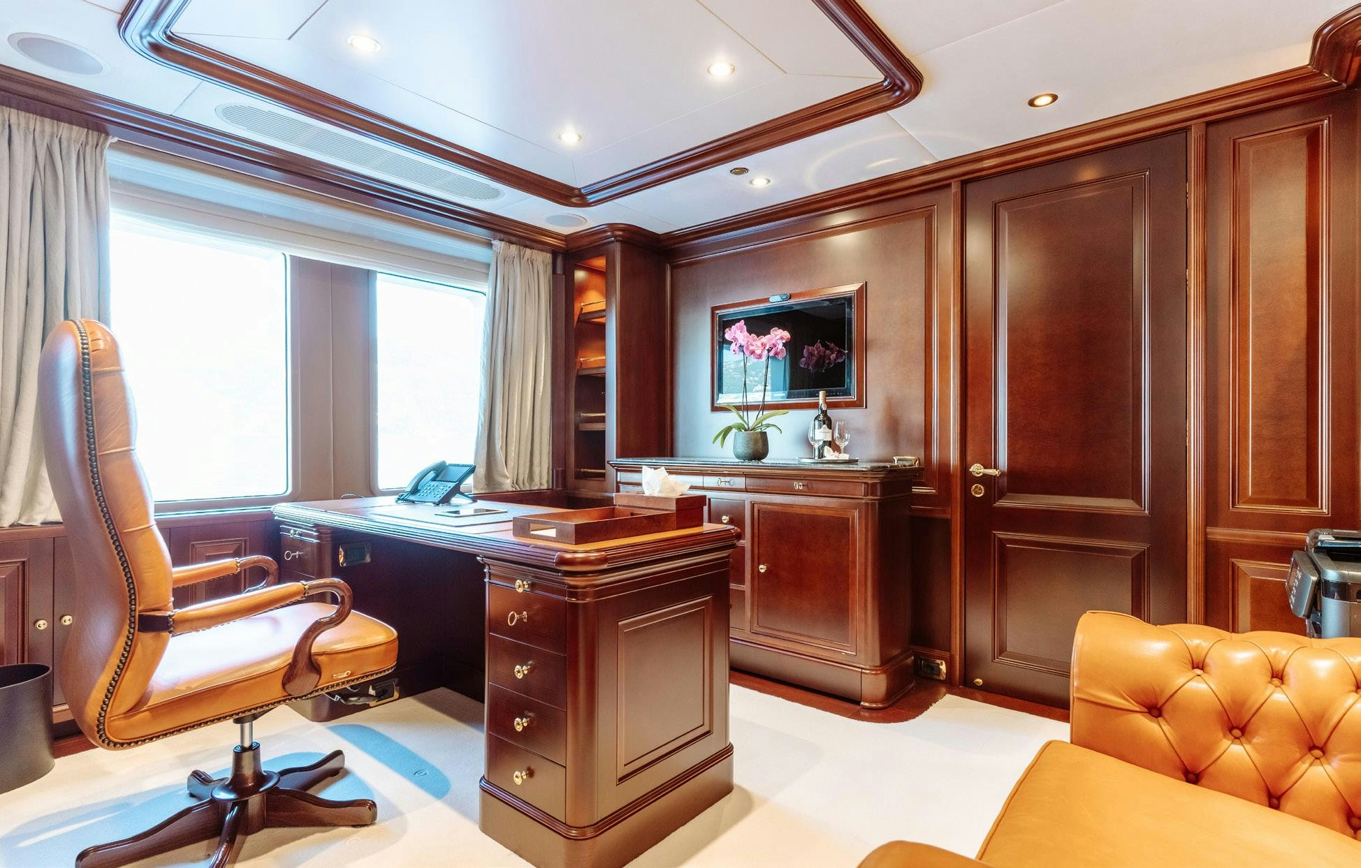 a living room with a kitchen and a living room aboard HEMABEJO Yacht for Charter