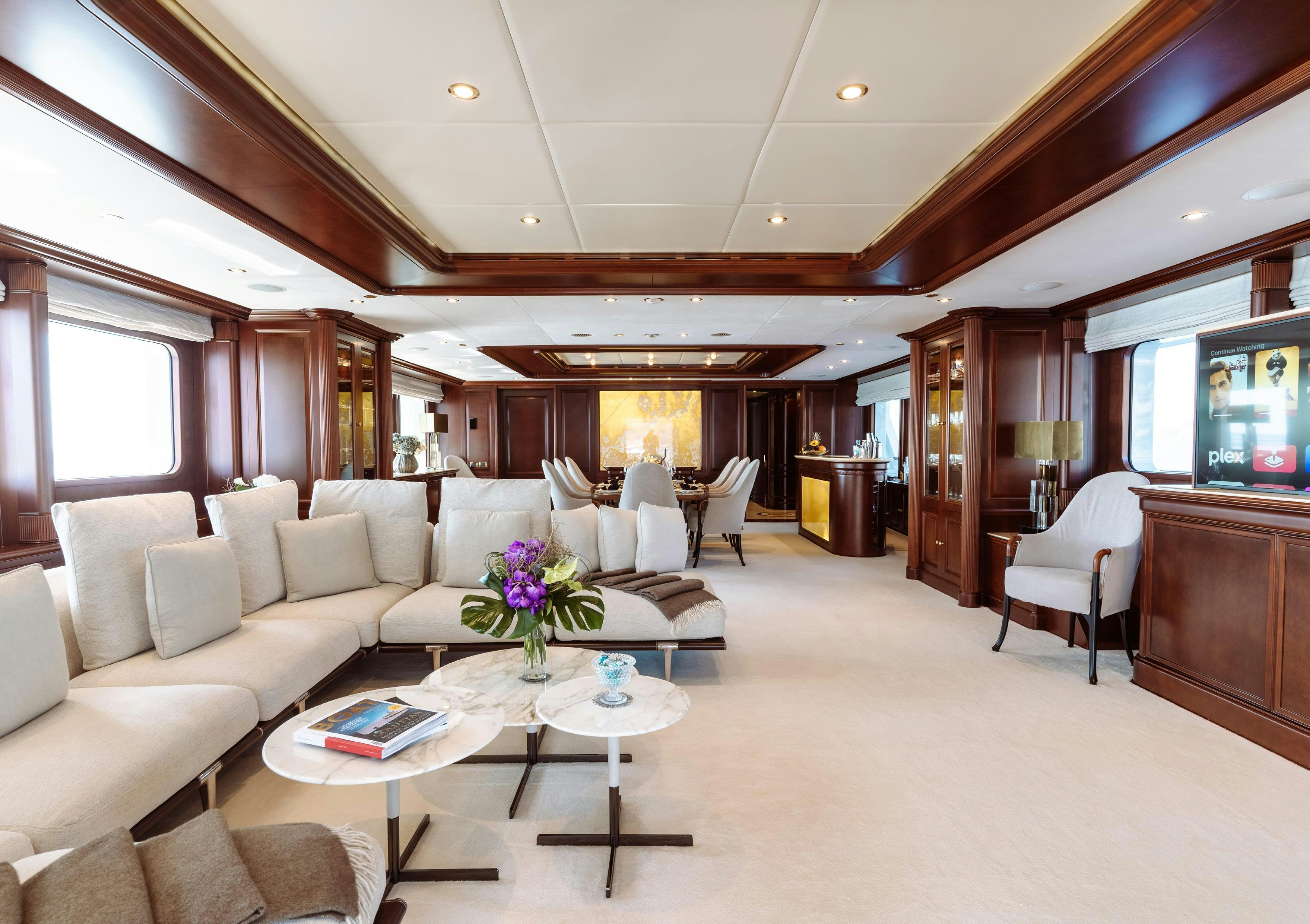 a living room with a large screen aboard HEMABEJO Yacht for Charter