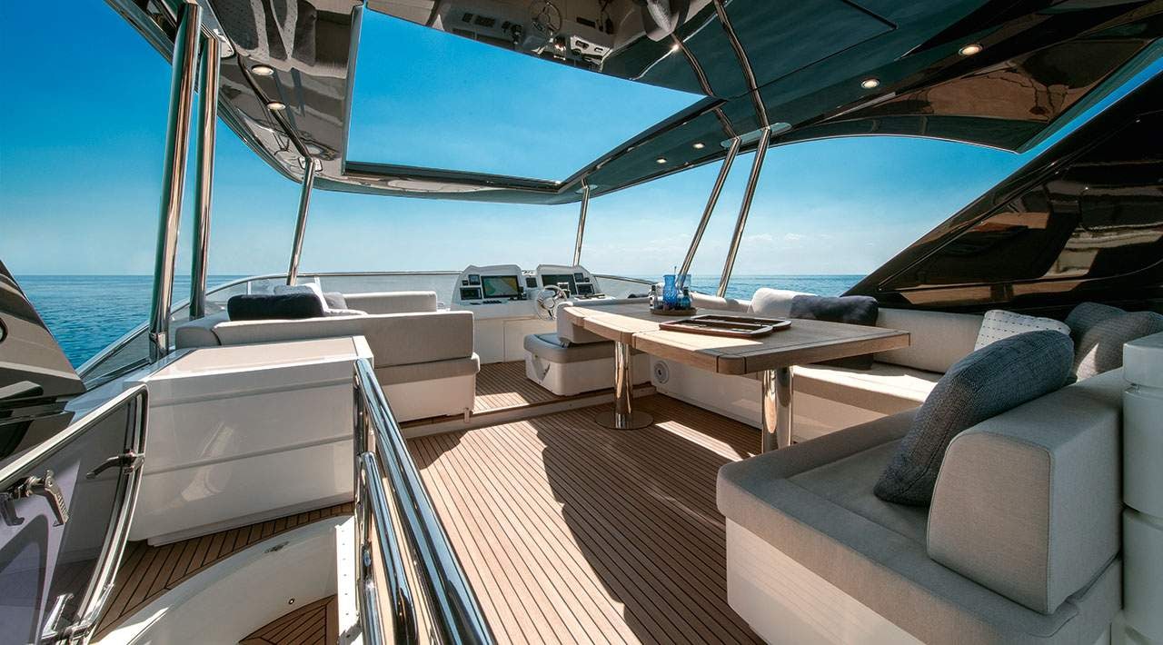 a boat with a table and chairs aboard GRACE Yacht for Sale